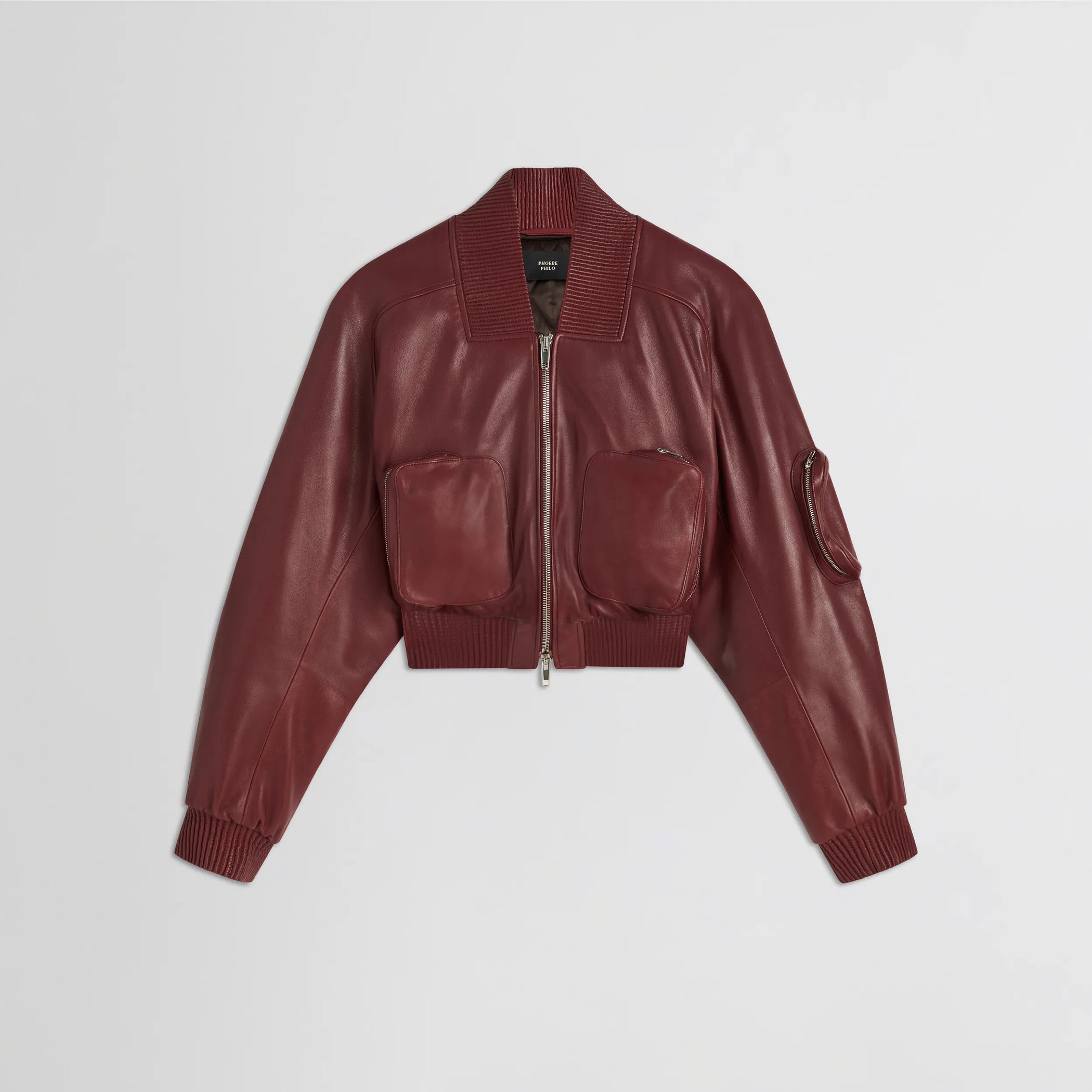 Flat front view of pocket bomber jacket in brick leather