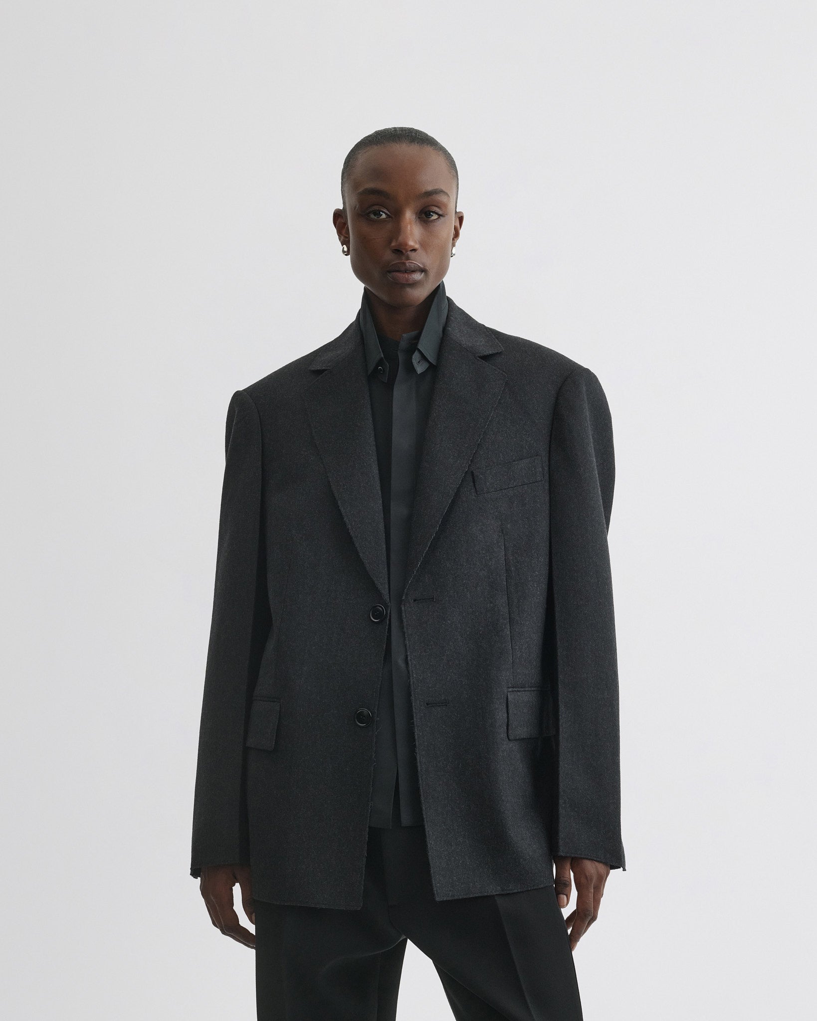 Front view of model wearing Tuxedo Jacket in anthracite wool