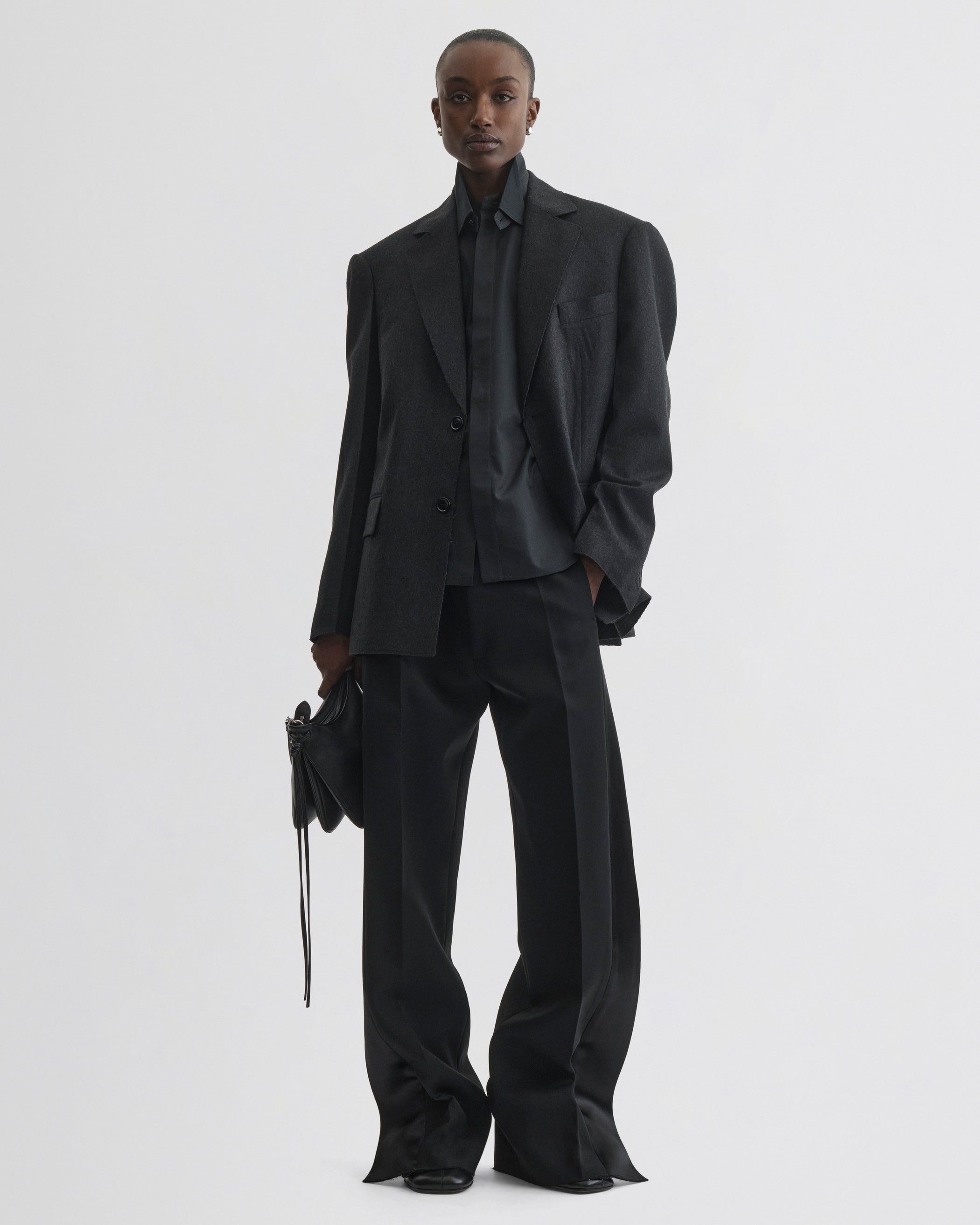 Front view of model wearing Tuxedo Jacket in anthracite wool
