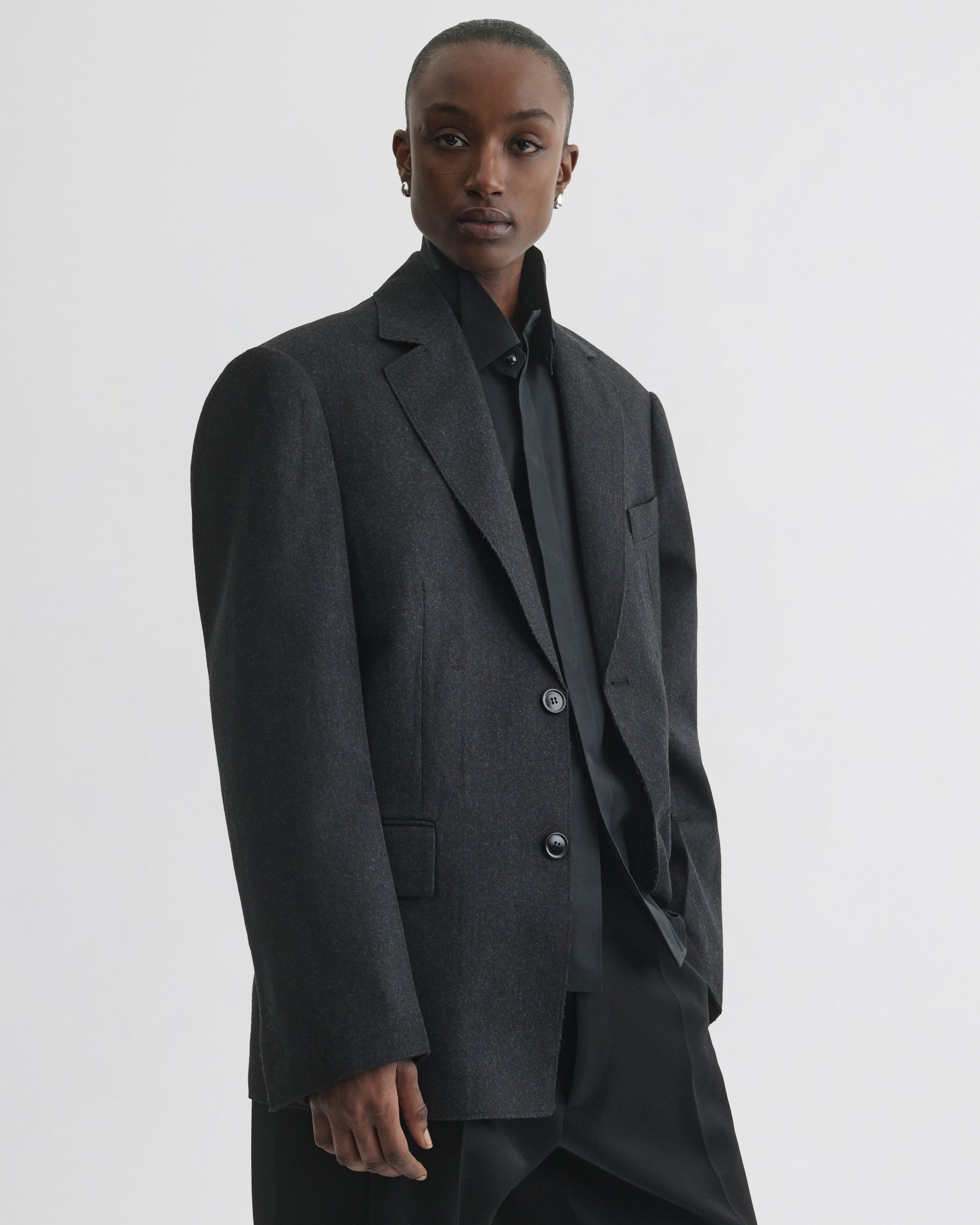 Front view of model wearing Tuxedo Jacket in anthracite wool