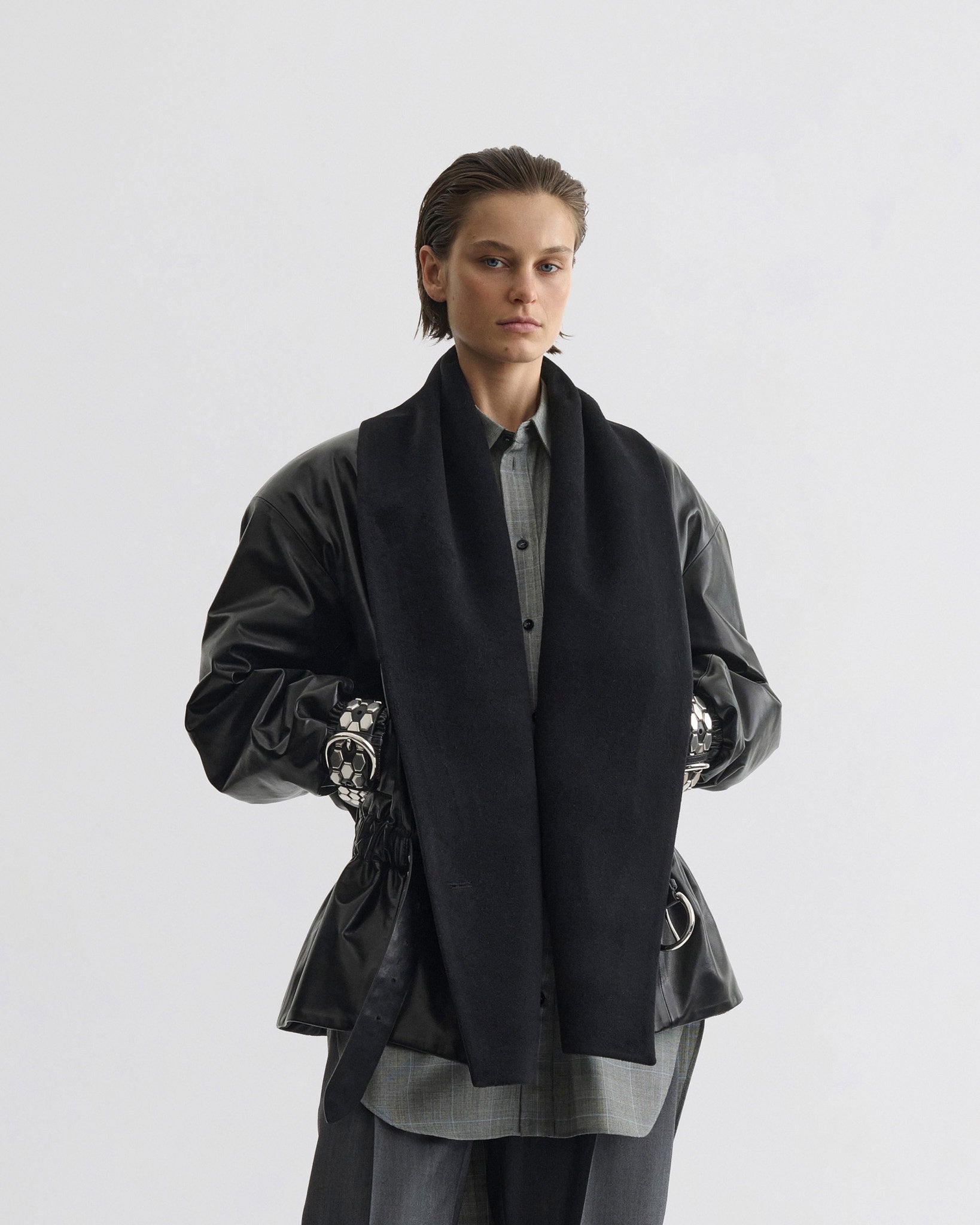 Front view of model wearing Stud Jacket in black leather