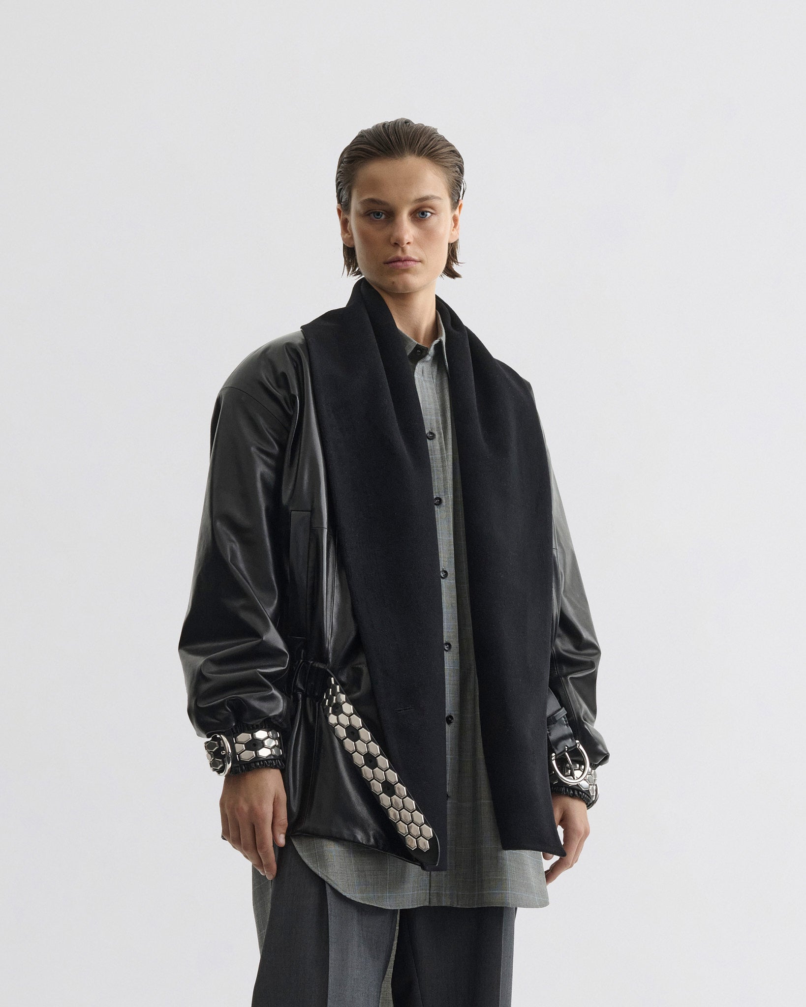 Front view of model wearing Stud Jacket in black leather