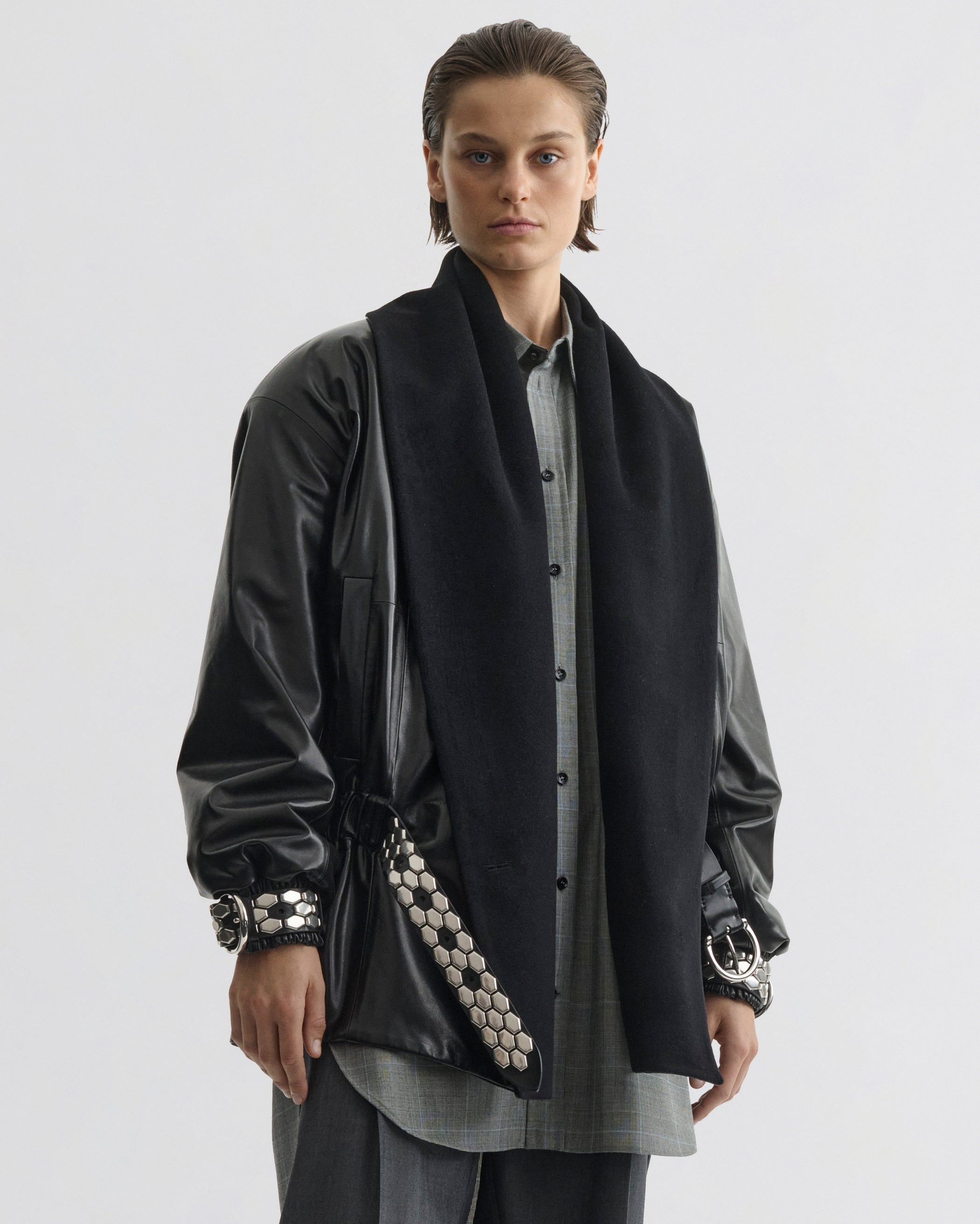 Front view of model wearing Stud Jacket in black leather