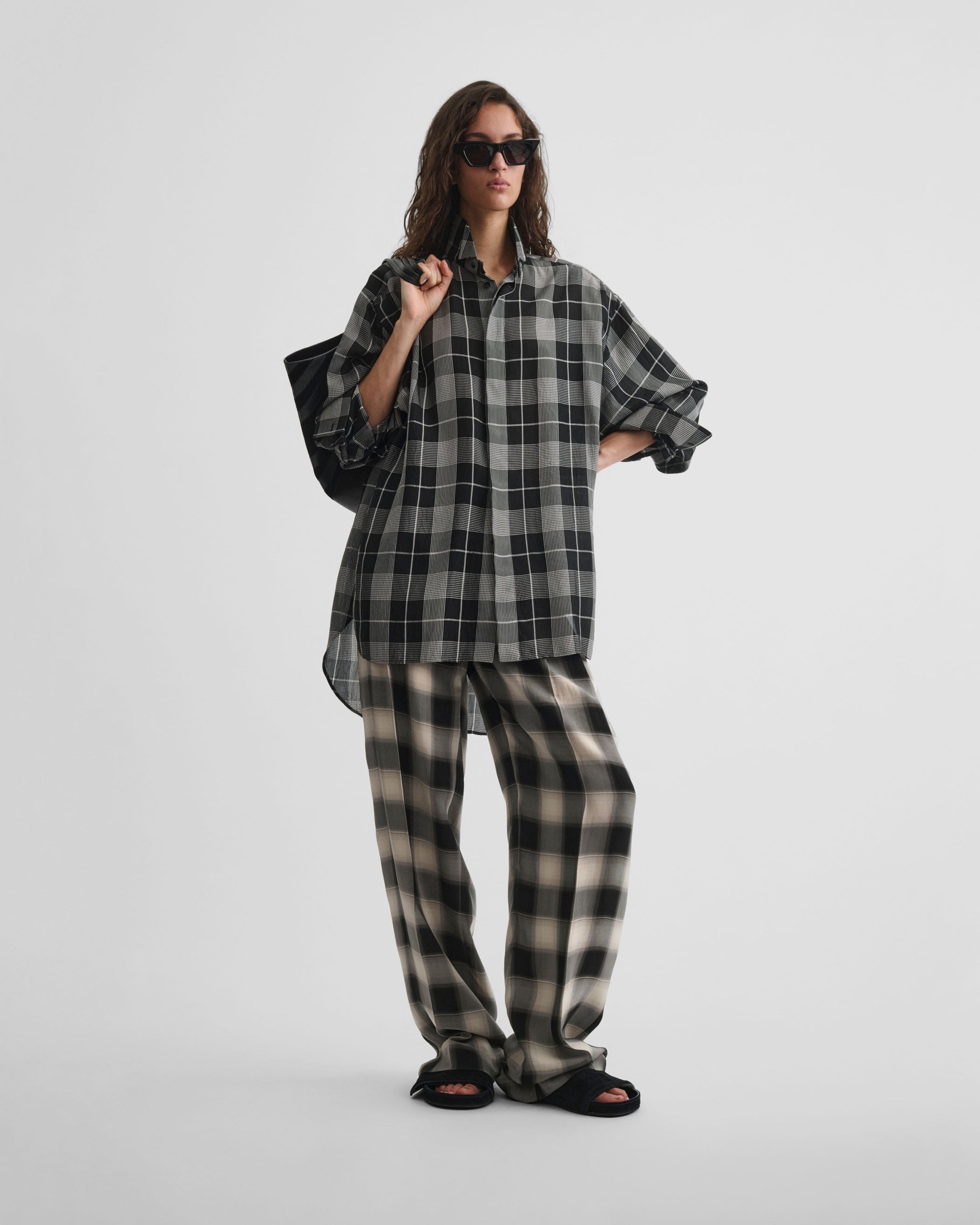 Front view of model wearing CUSTOM TUX SHIRT in b/w check viscose
