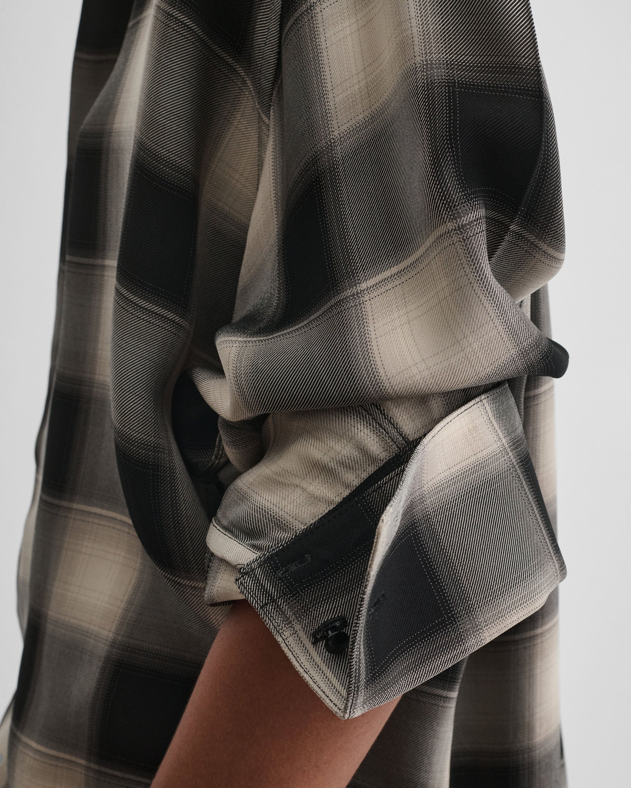 Close up detail view of model wearing CUSTOM TUX SHIRT in b/b check viscose