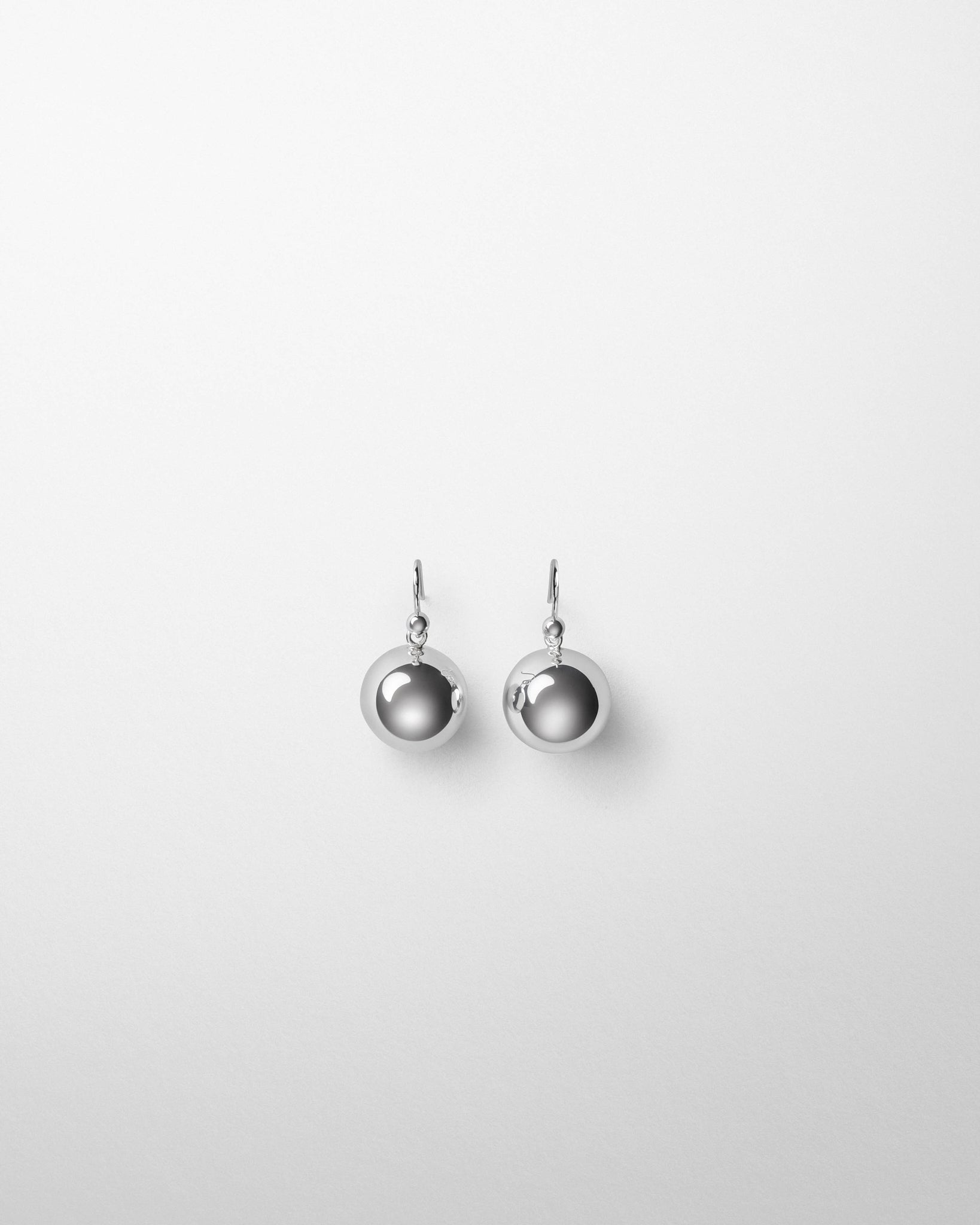 Flat front view of SPHERE EARRINGS in silver