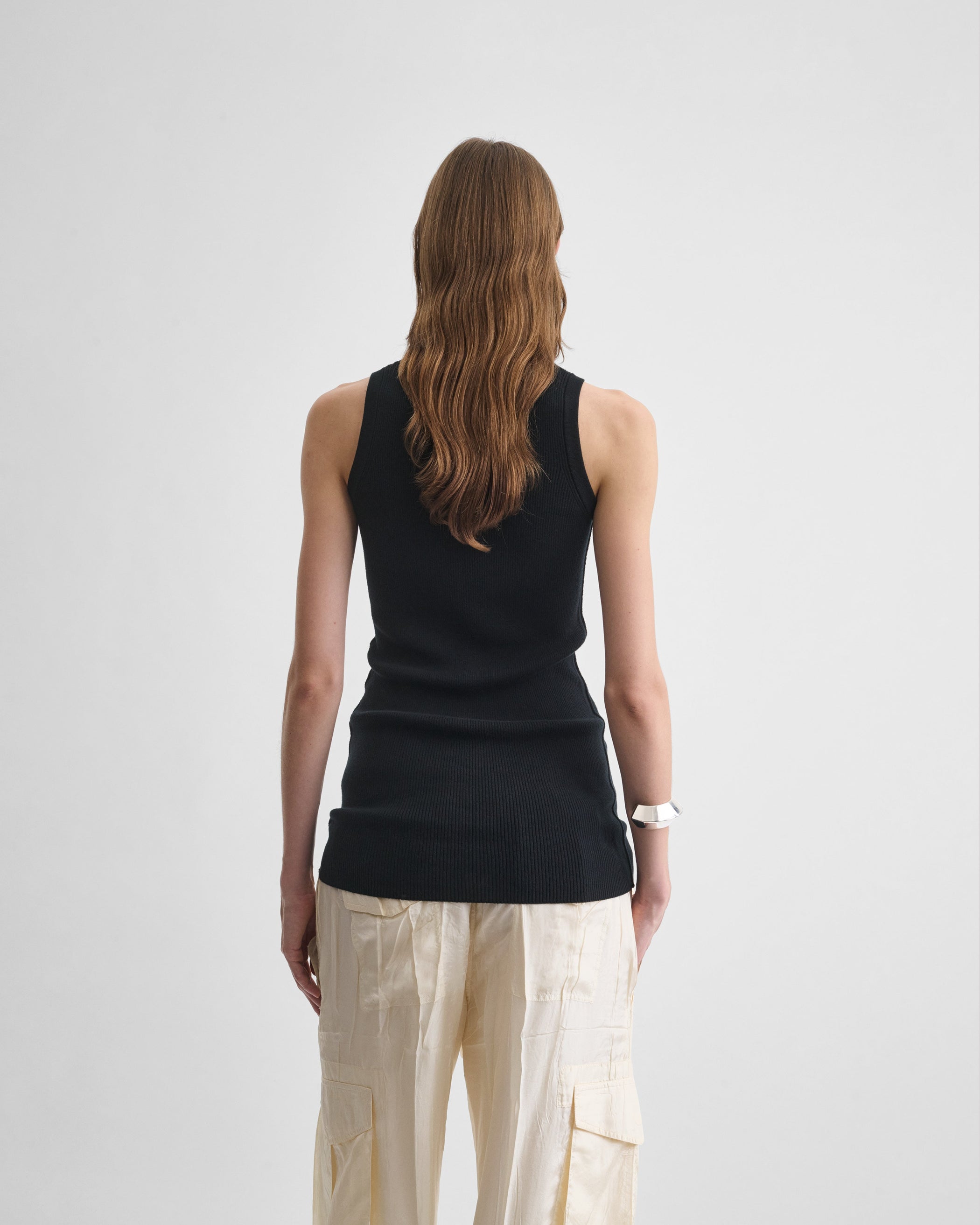 Back view of model wearing the RIB TANK in black wool