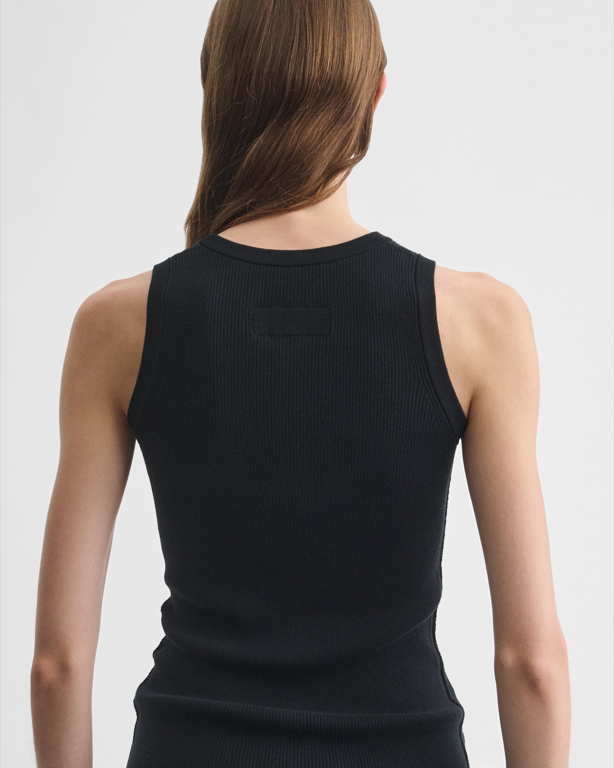 Back detail view of model wearing the RIB TANK in black wool