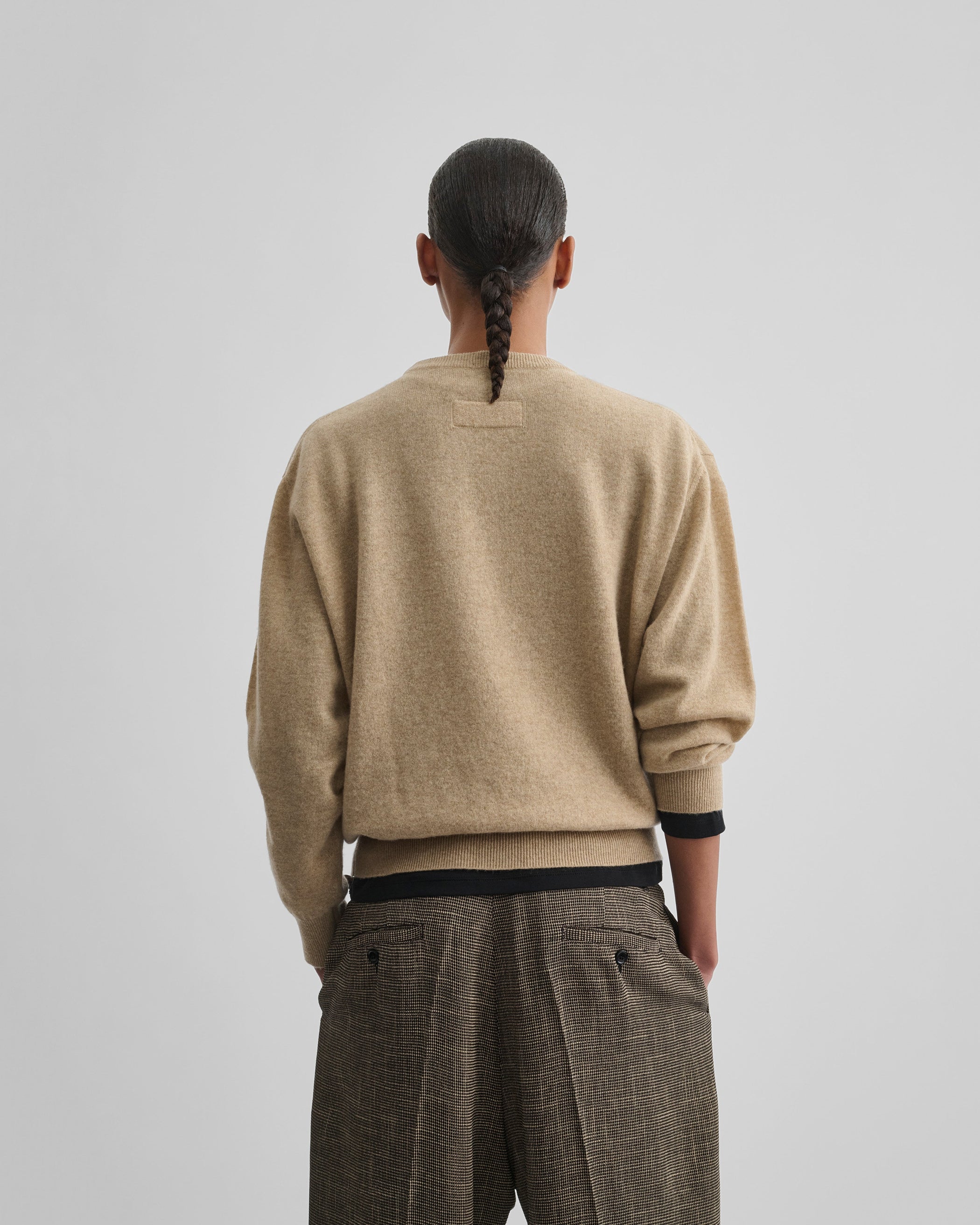 Back view of model wearing CLASSIC CREW NECK in oatmeal wool