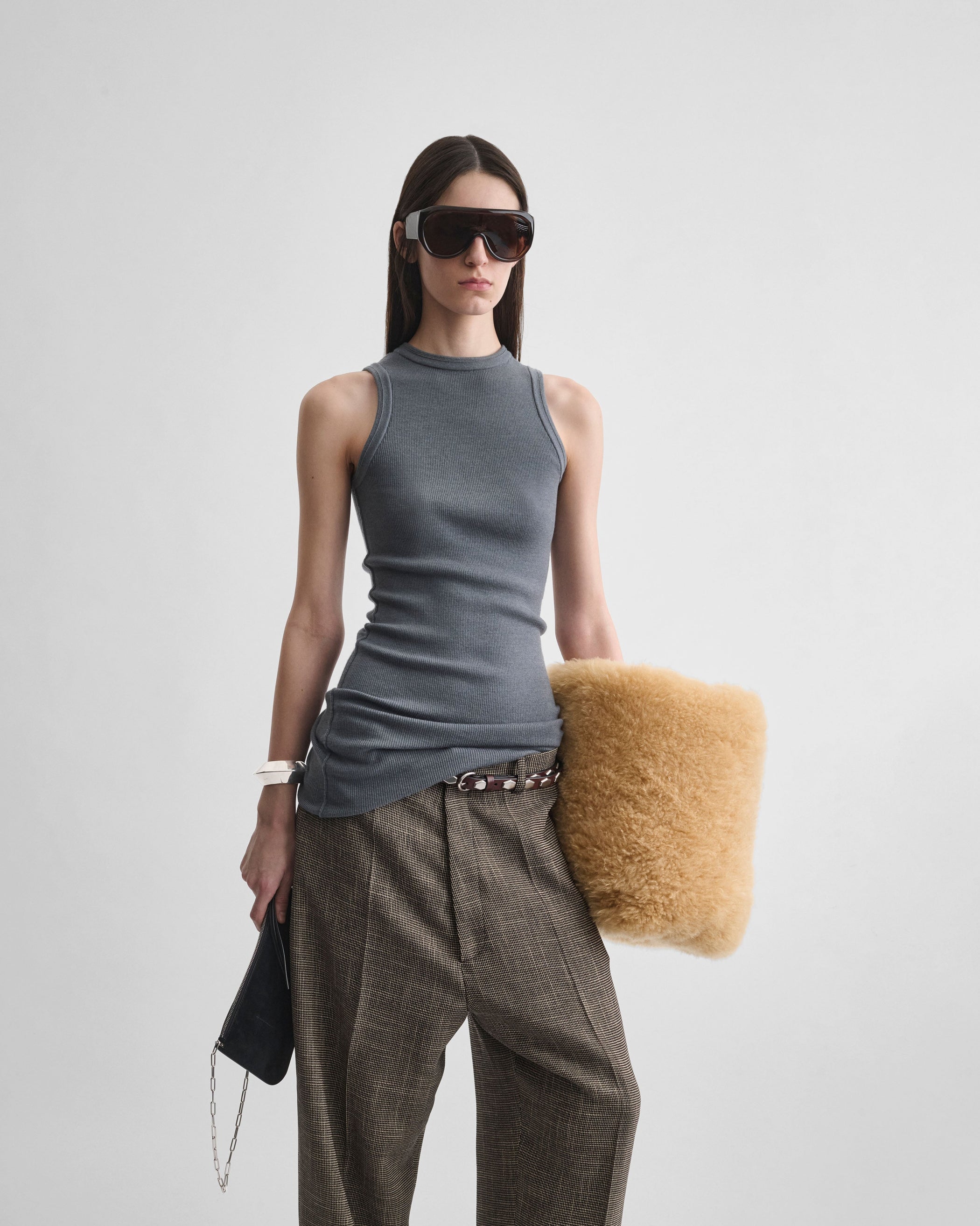 Front view of model wearing RIBBED TANK in moss green wool