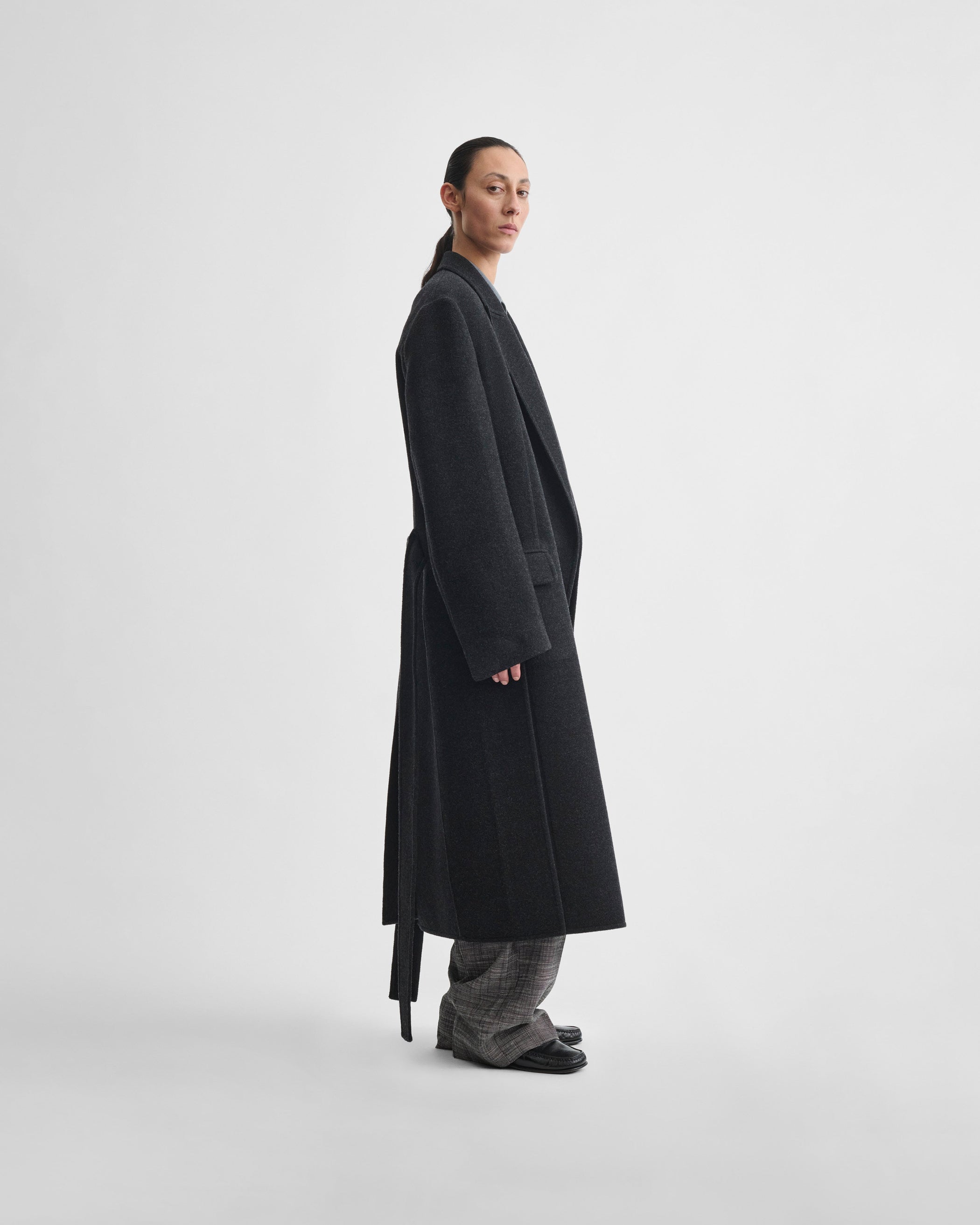 Side view of model wearing MAN'S ROBE COAT in anthracite wool