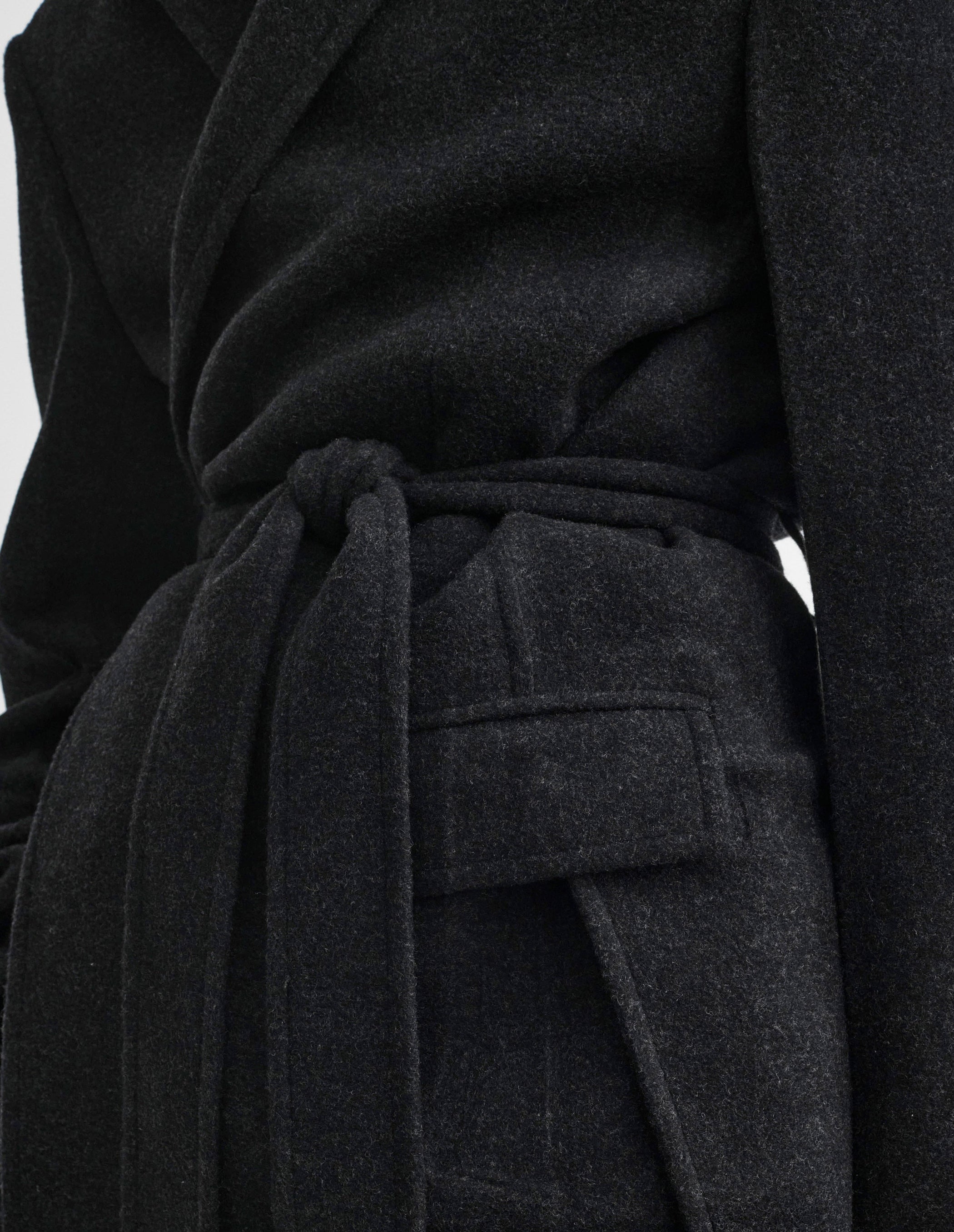 Side detail view of model wearing MAN'S ROBE COAT in anthracite wool