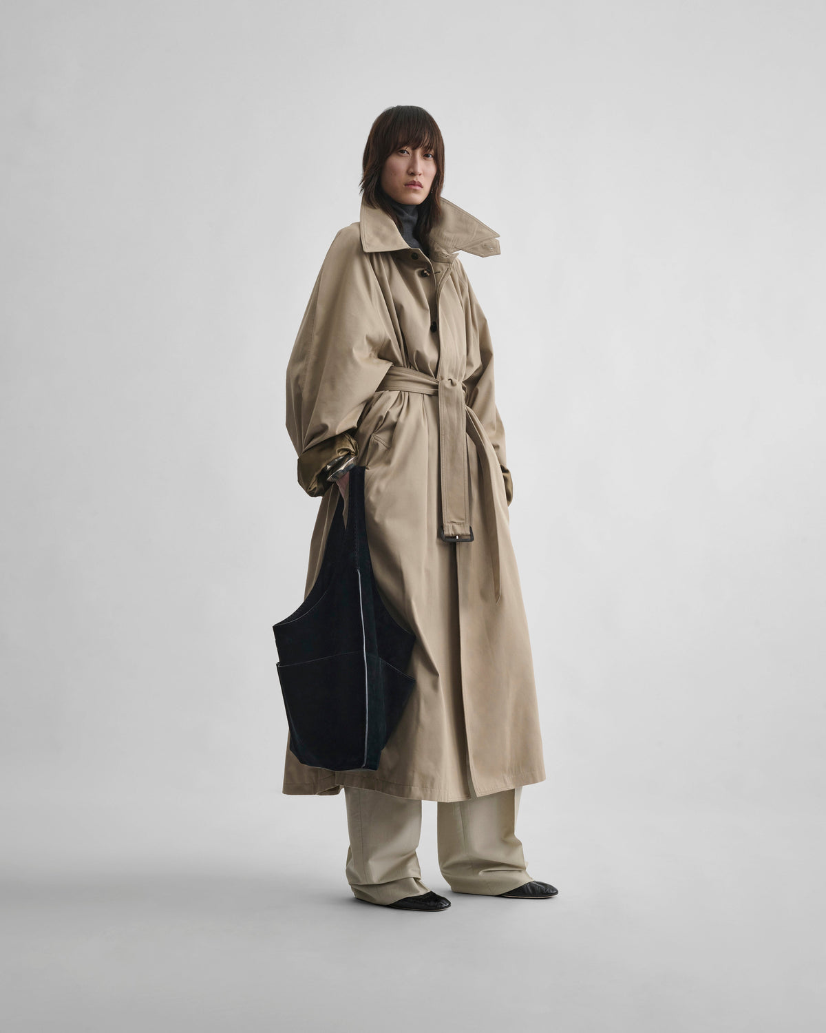 Front view of model wearing BIG TRENCH in sand cotton