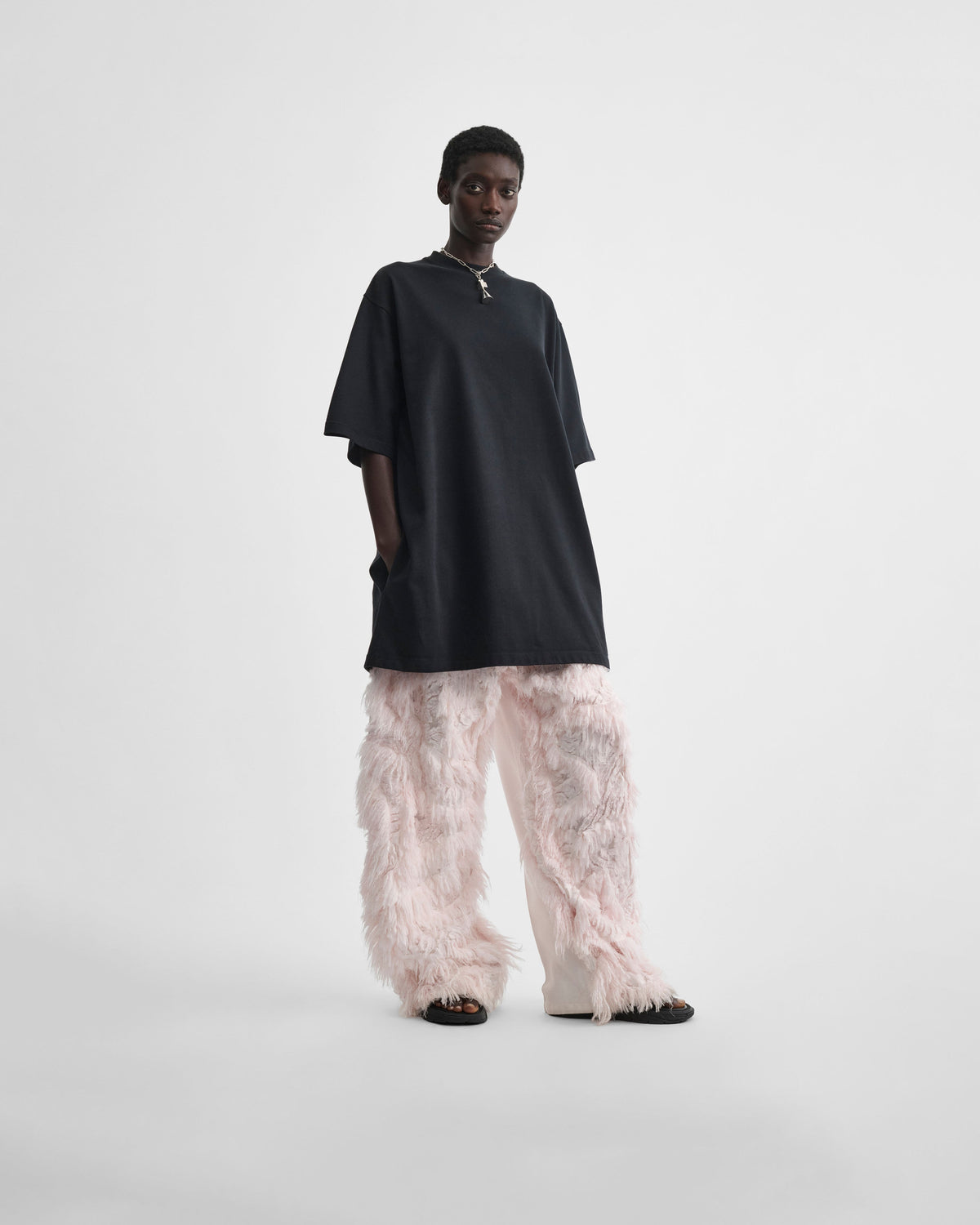 Flat view of model wearing COMBED EMBROIDERED TROUSERS in floss viscose