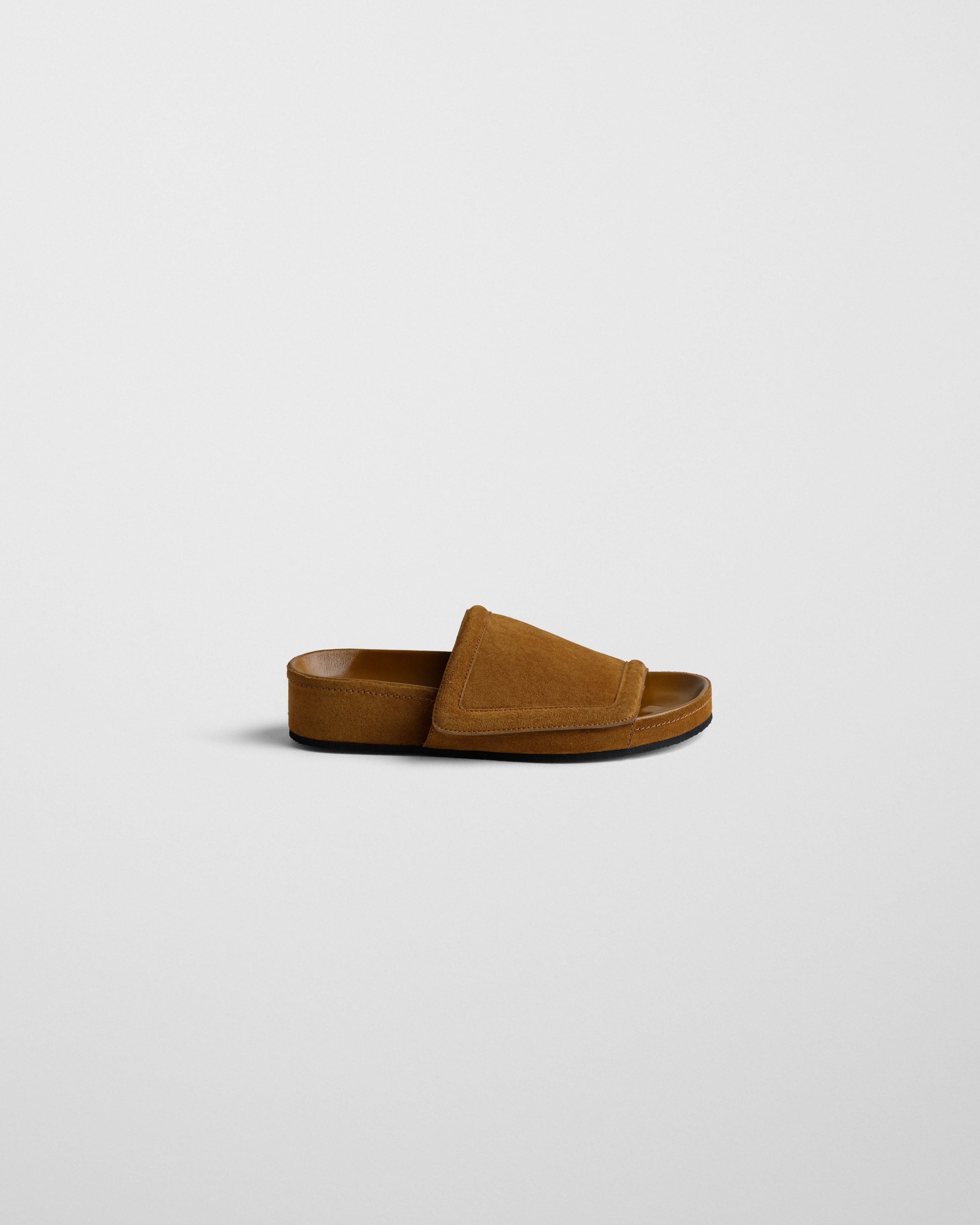 Side view of WIDE SLIDE in toffee suede