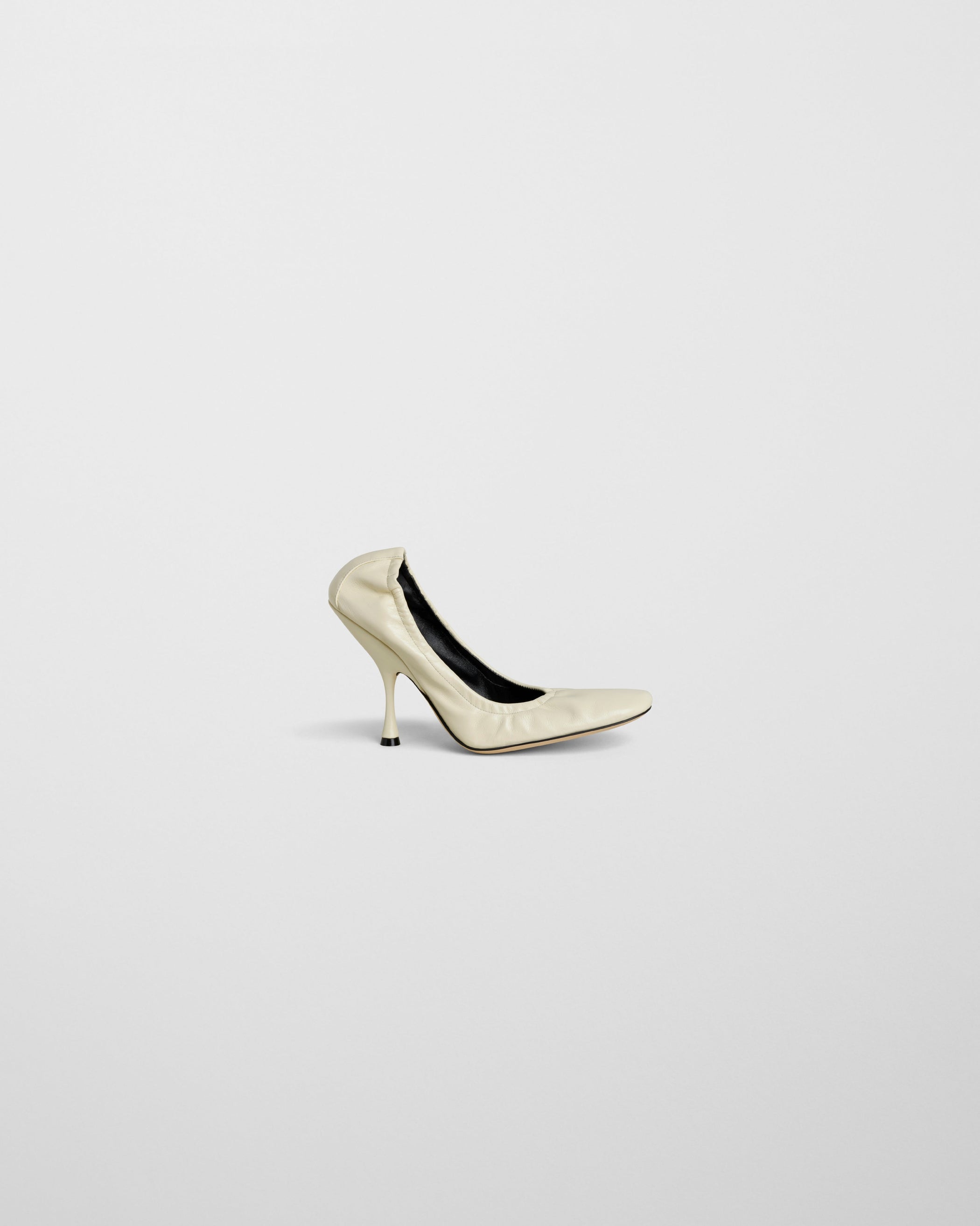 Side view of PUCKER PUMP 100 in stucco leather flatshot]