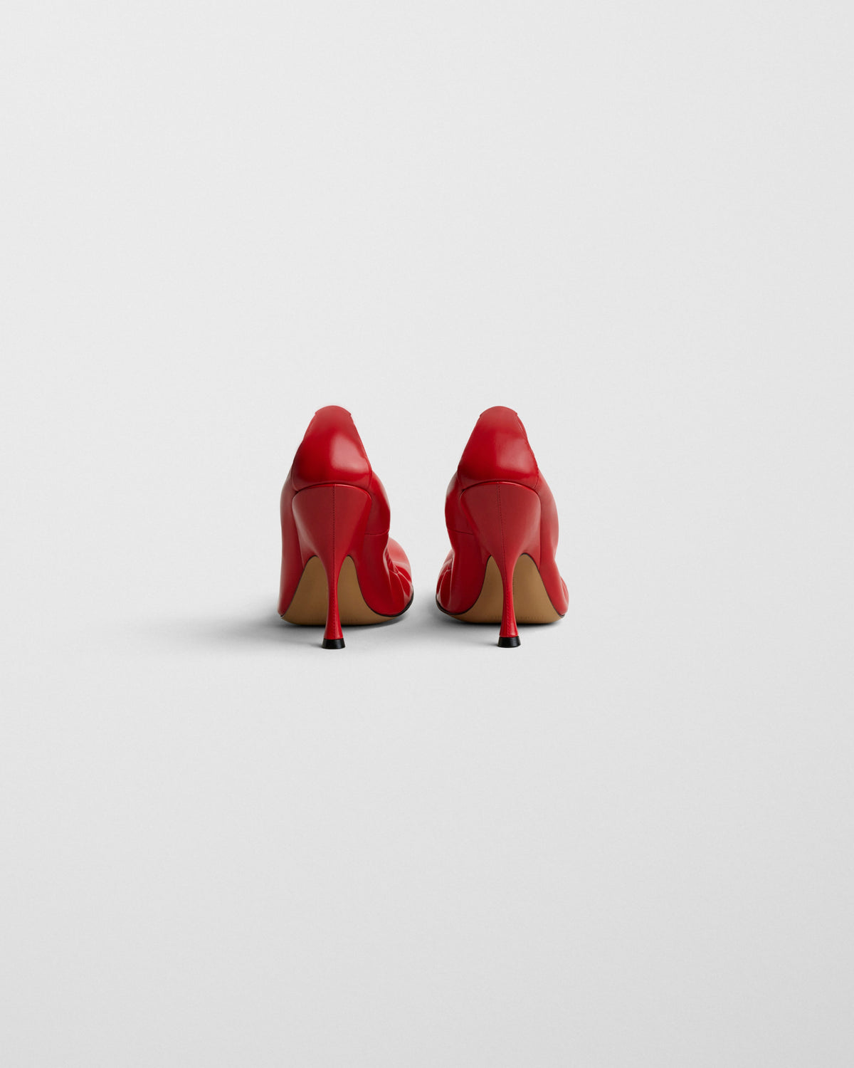 Back view of PUCKER PUMP 100 in bright red leather