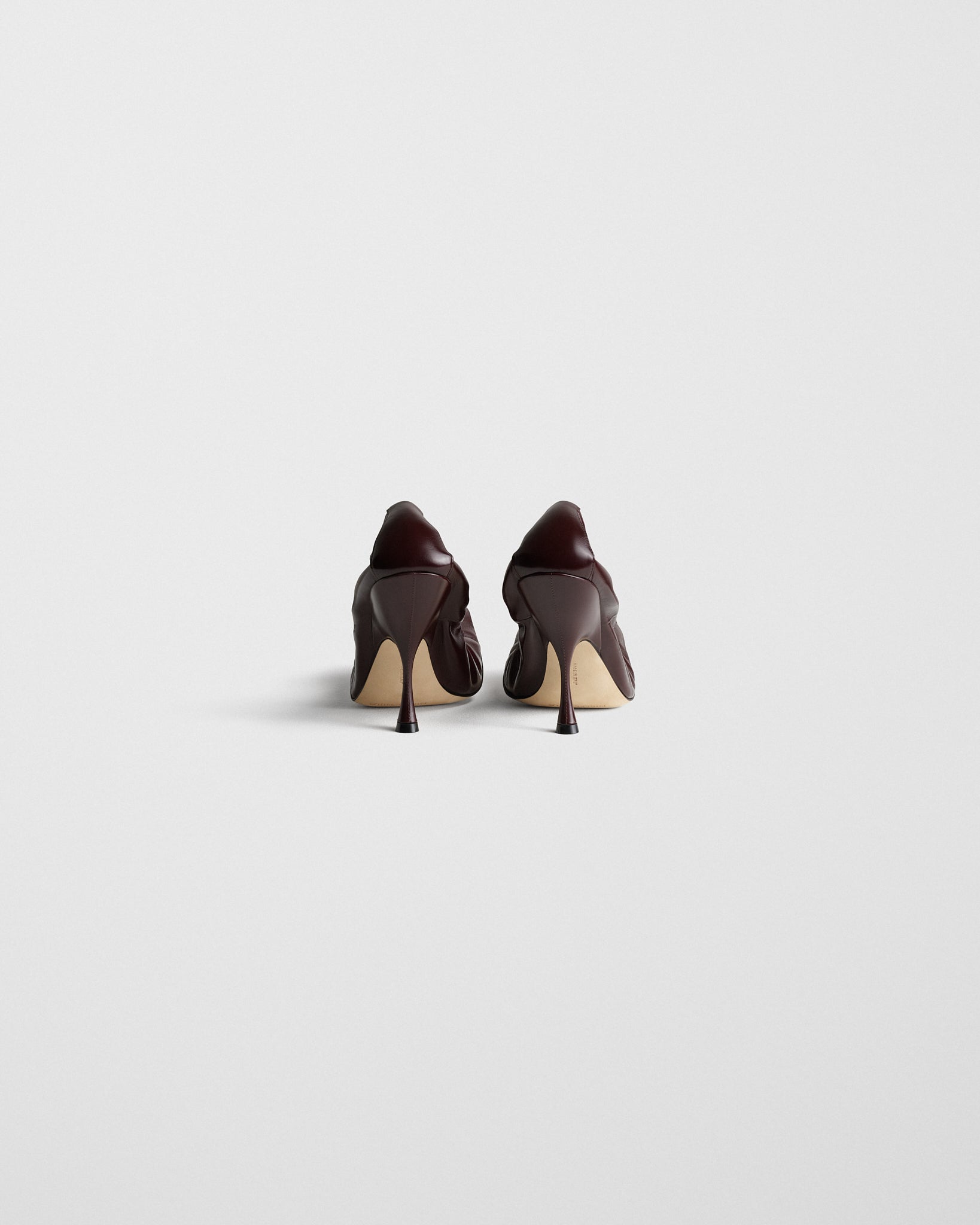 Back view of PUCKER PUMP 100 in oxblood leather