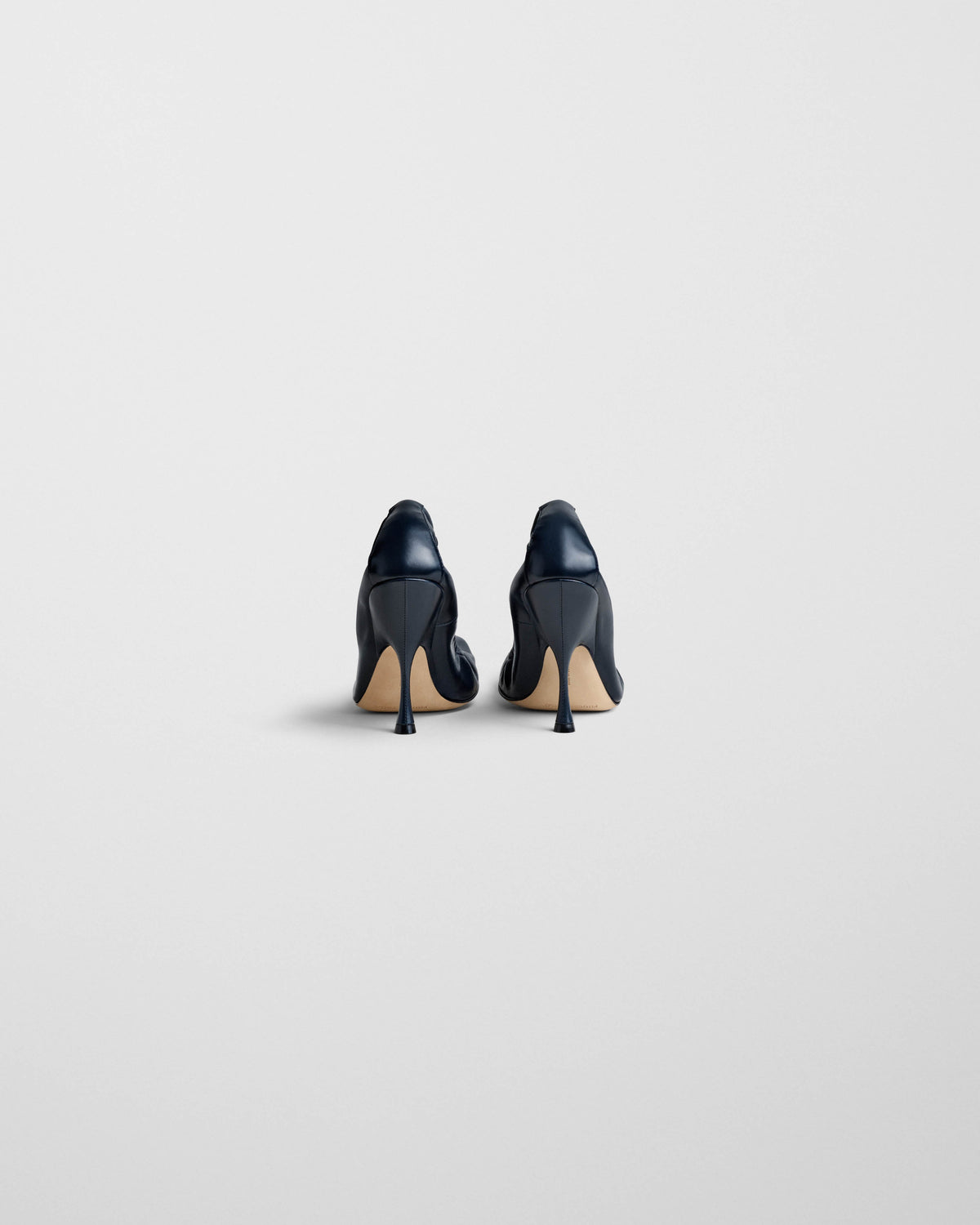 Back view of PUCKER PUMP 100 in dark navy leather