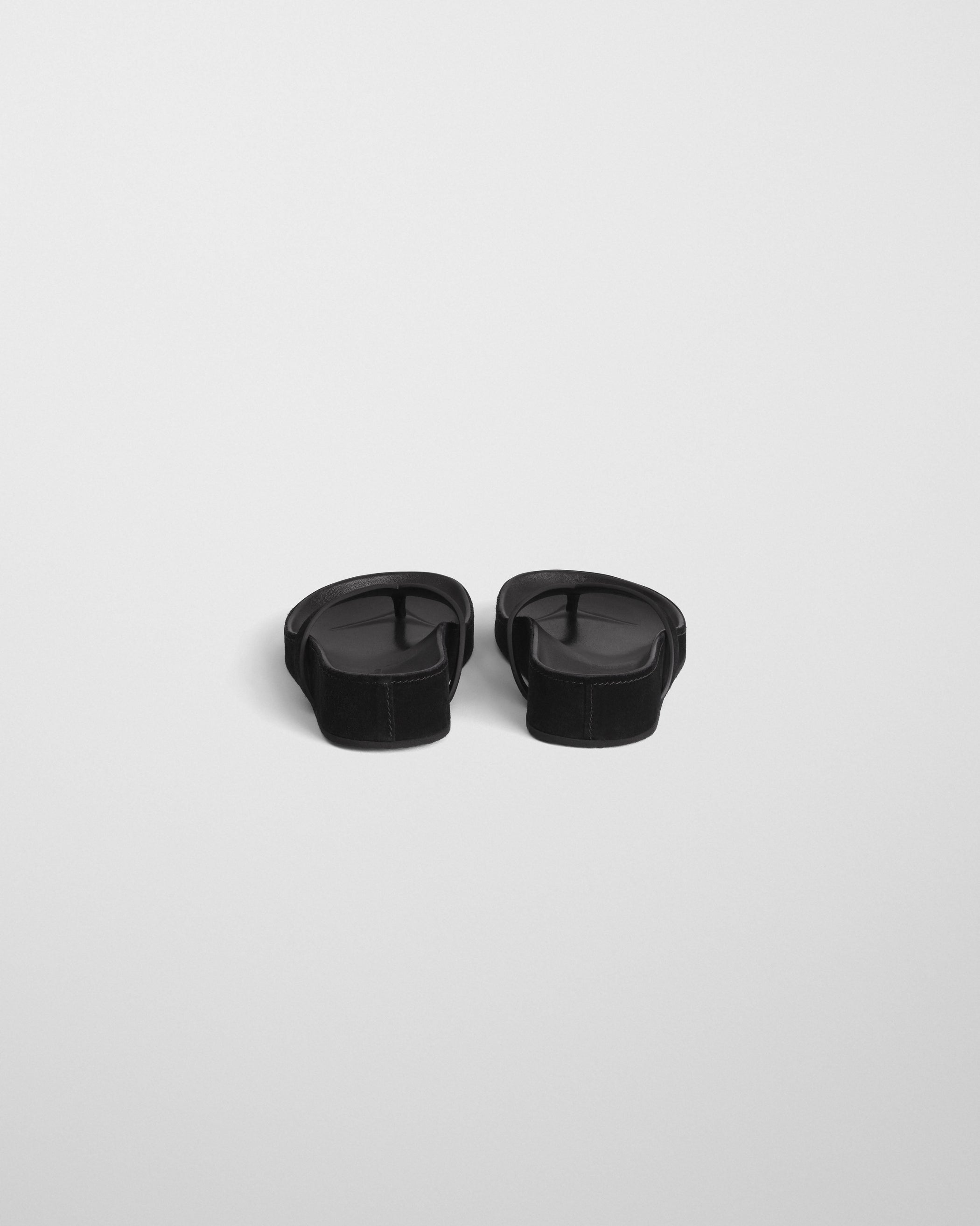Back view of ROUND FLIP FLOP in black suede