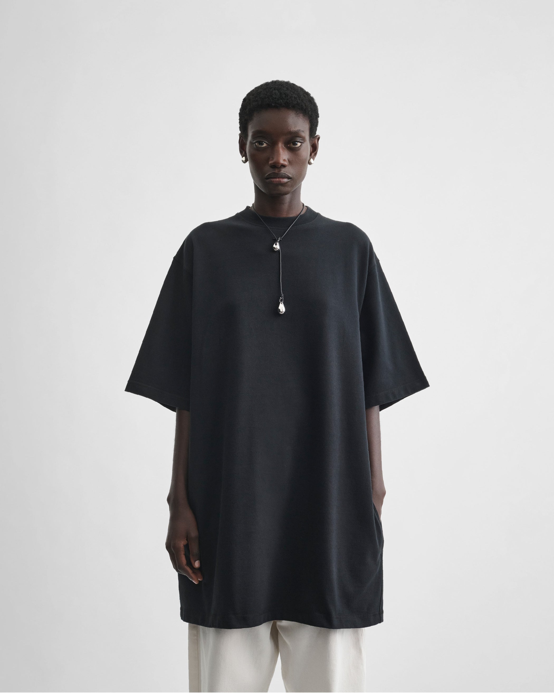 Front view of model wearing BIG T in black cotton