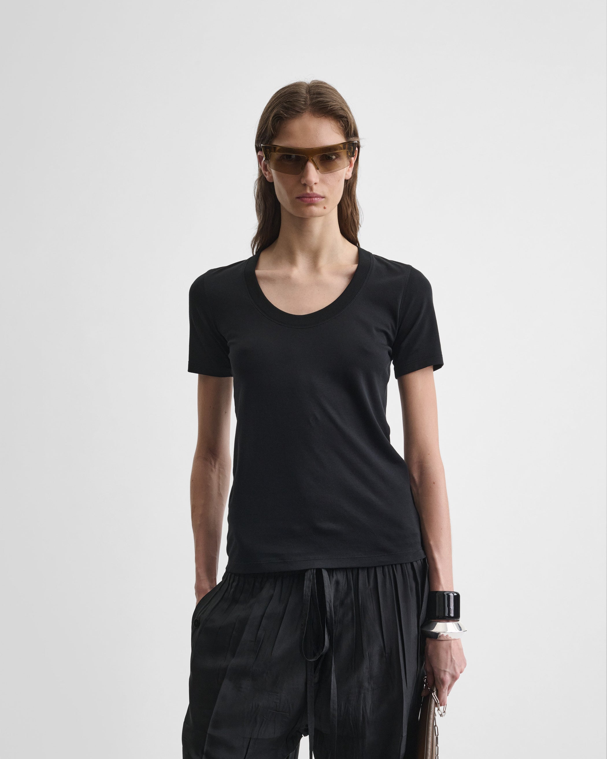 Front close view of model wearing SCOOP T. in black cotton