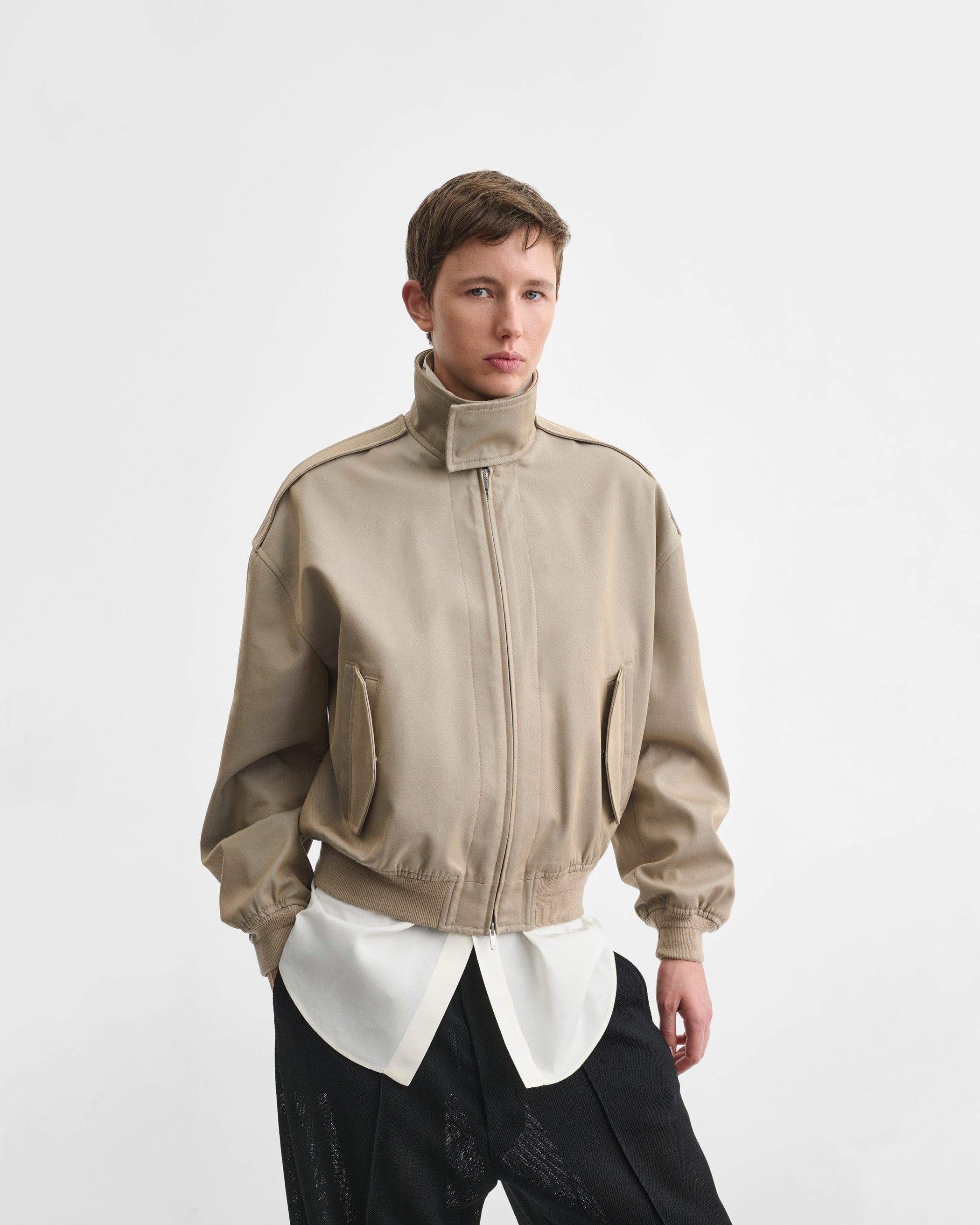 Front view of model wearing the HARRINGTON JACKET in desert cotton