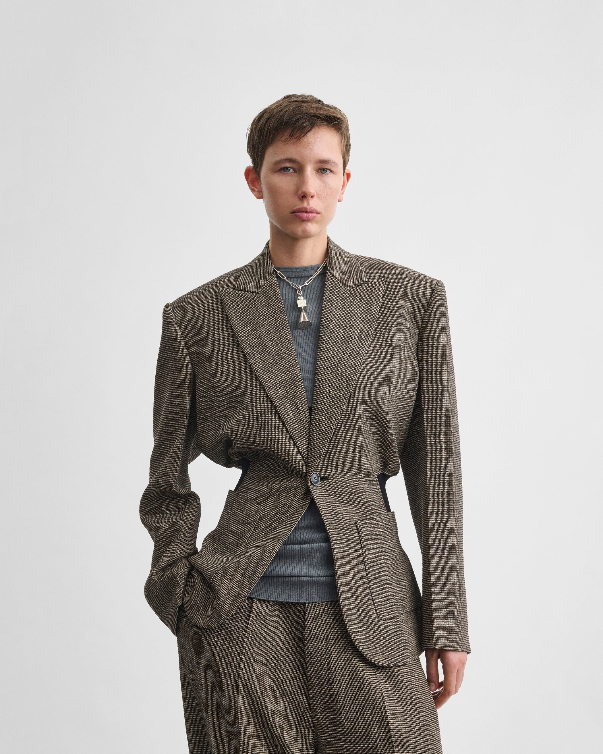 Front view of model wearing KICK TAILORED JACKET in salt and pepper viscose