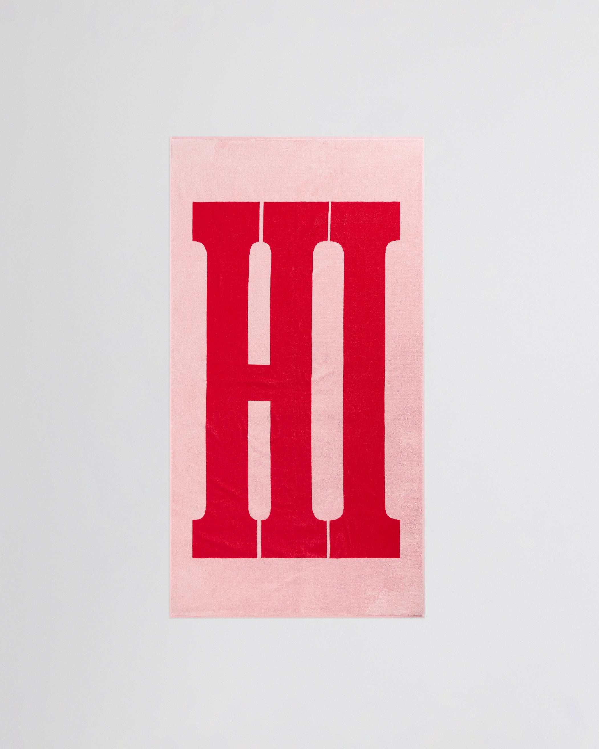 Flat front view of HI TOWEL in washed pink cotton