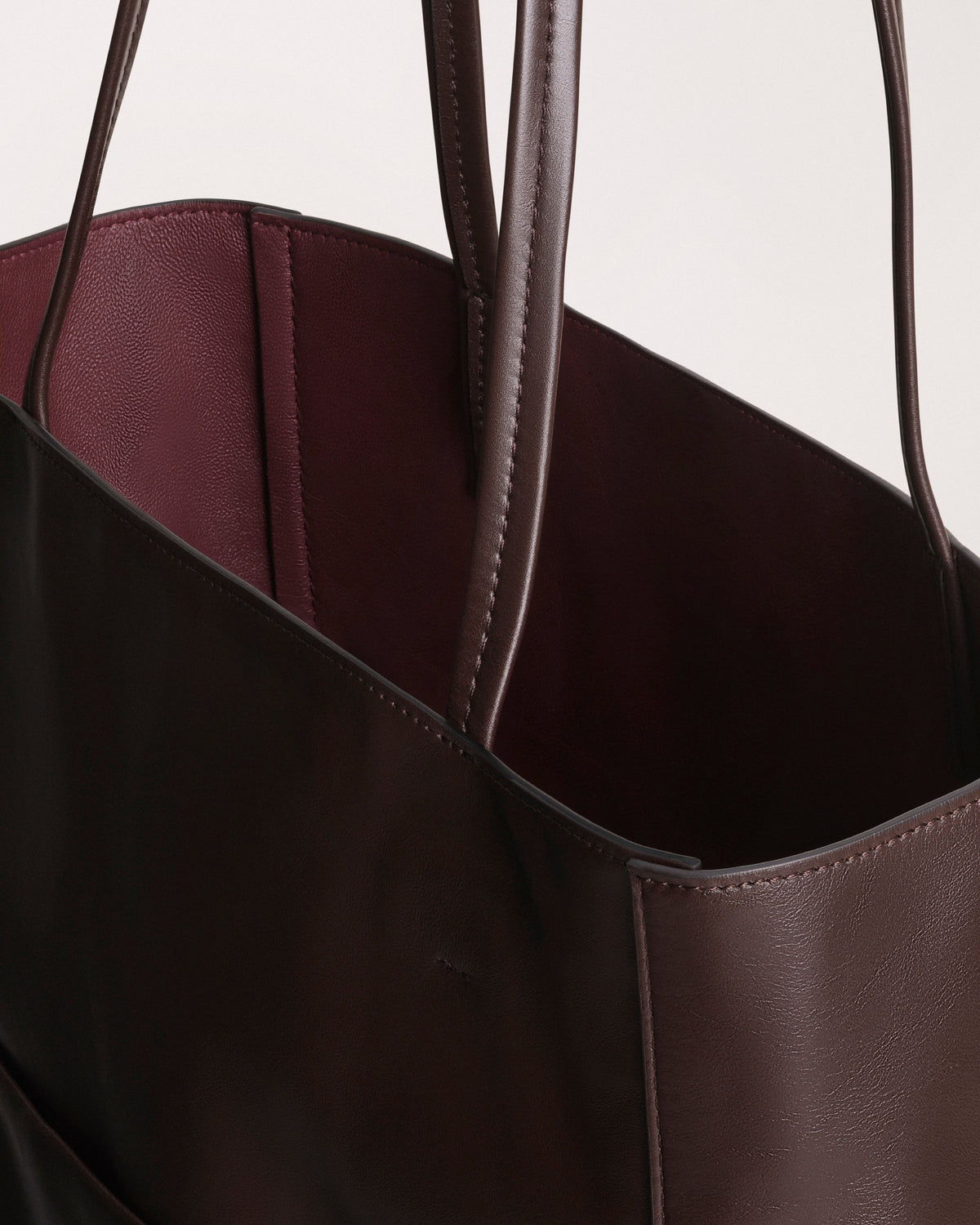 Detail view of PAPER TOTE in chocolate brown leather