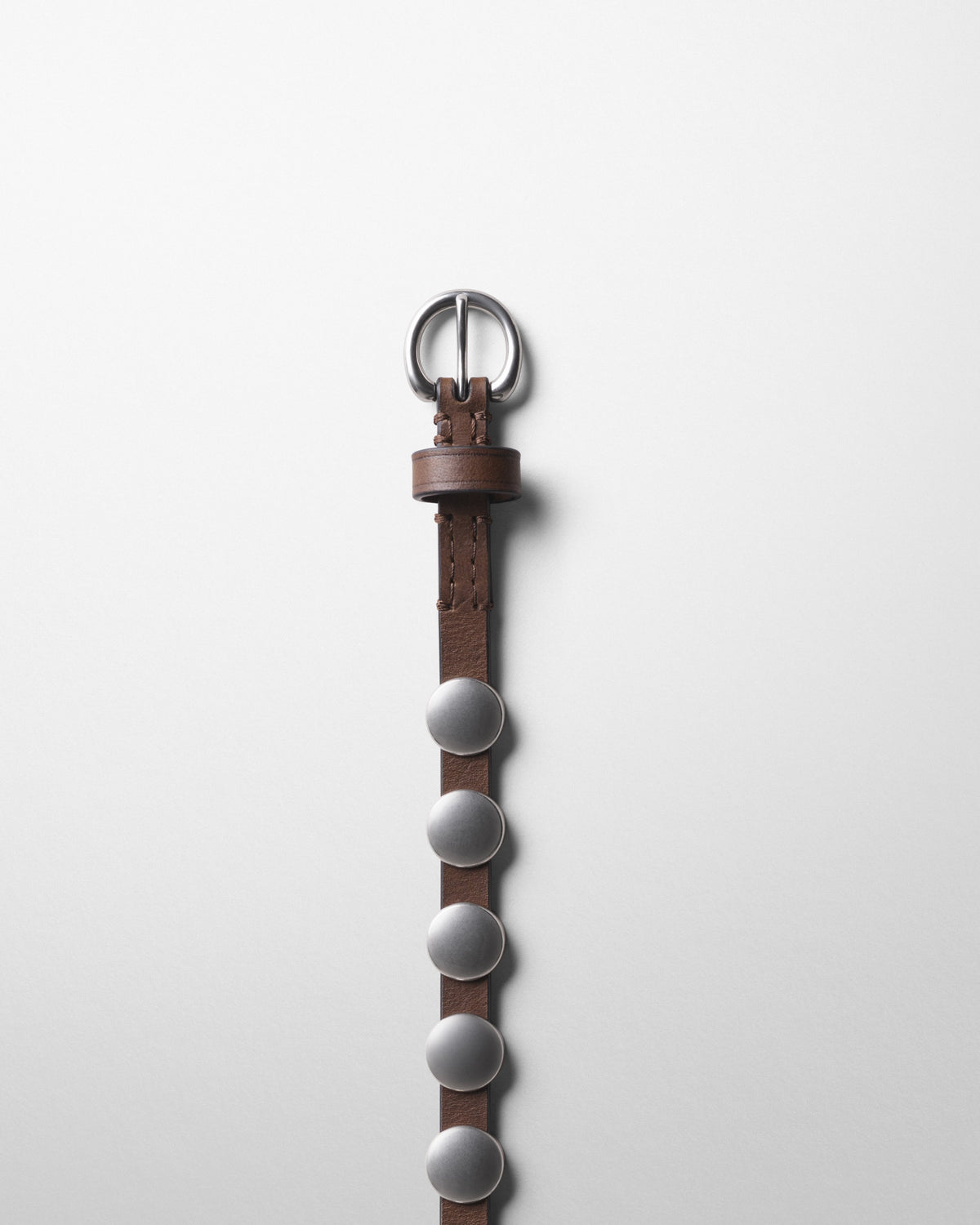Detail view of THIN STUDDED BELT in dark khaki leather
