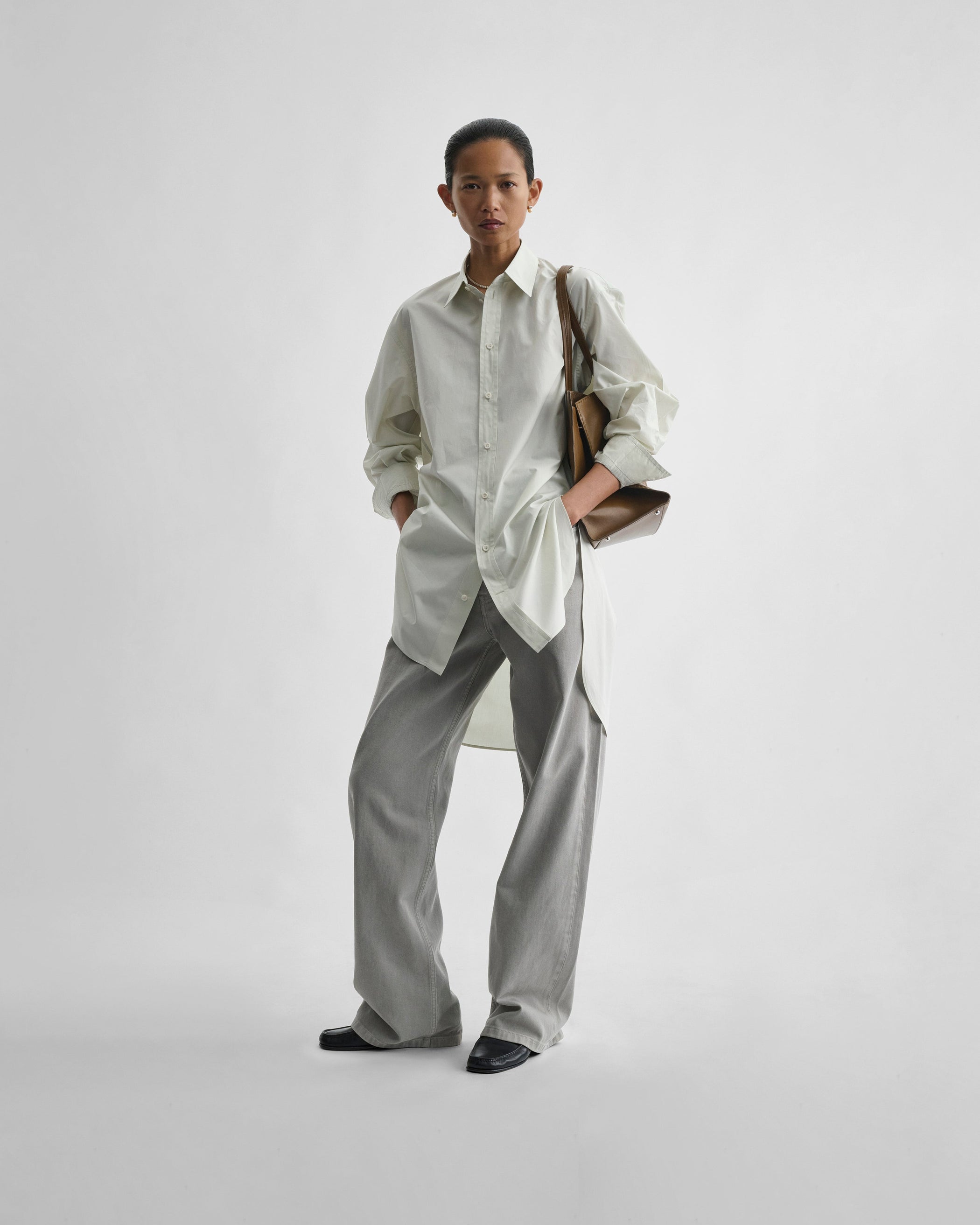 Front view of model wearing ELONGATED SHIRT in soft mint cotton