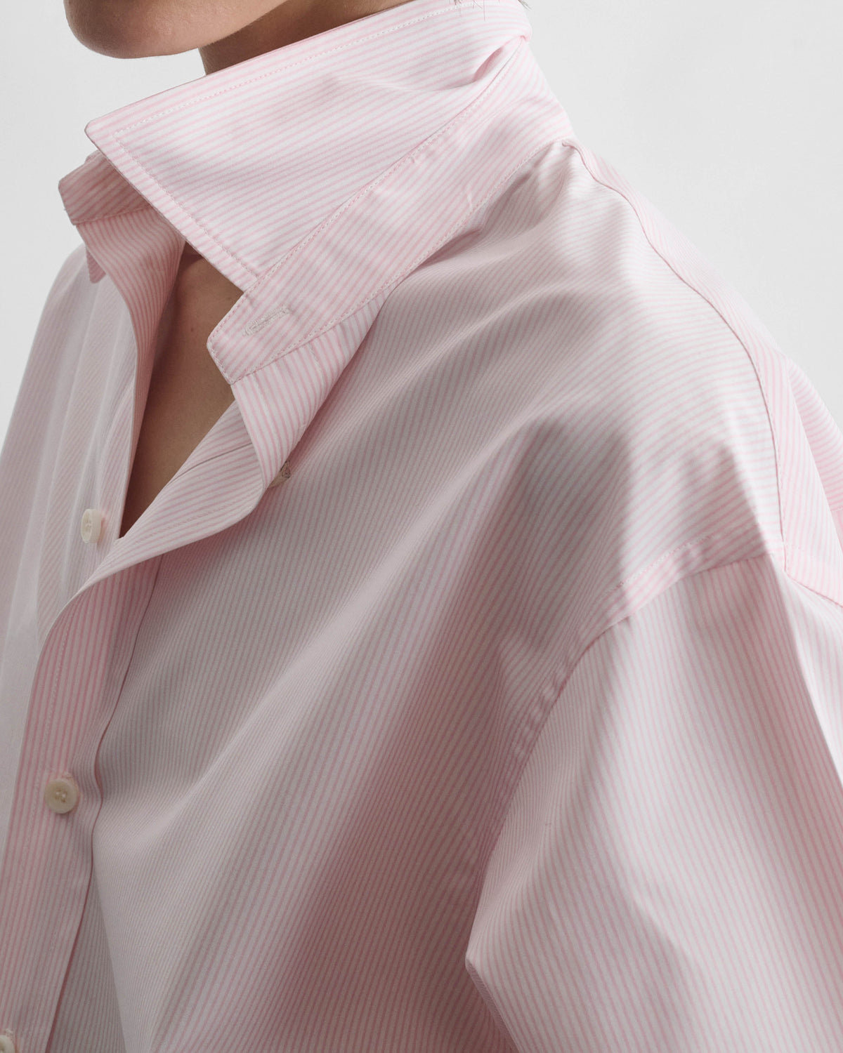 Detail view of model wearing MEN'S SHIRT in pink cotton