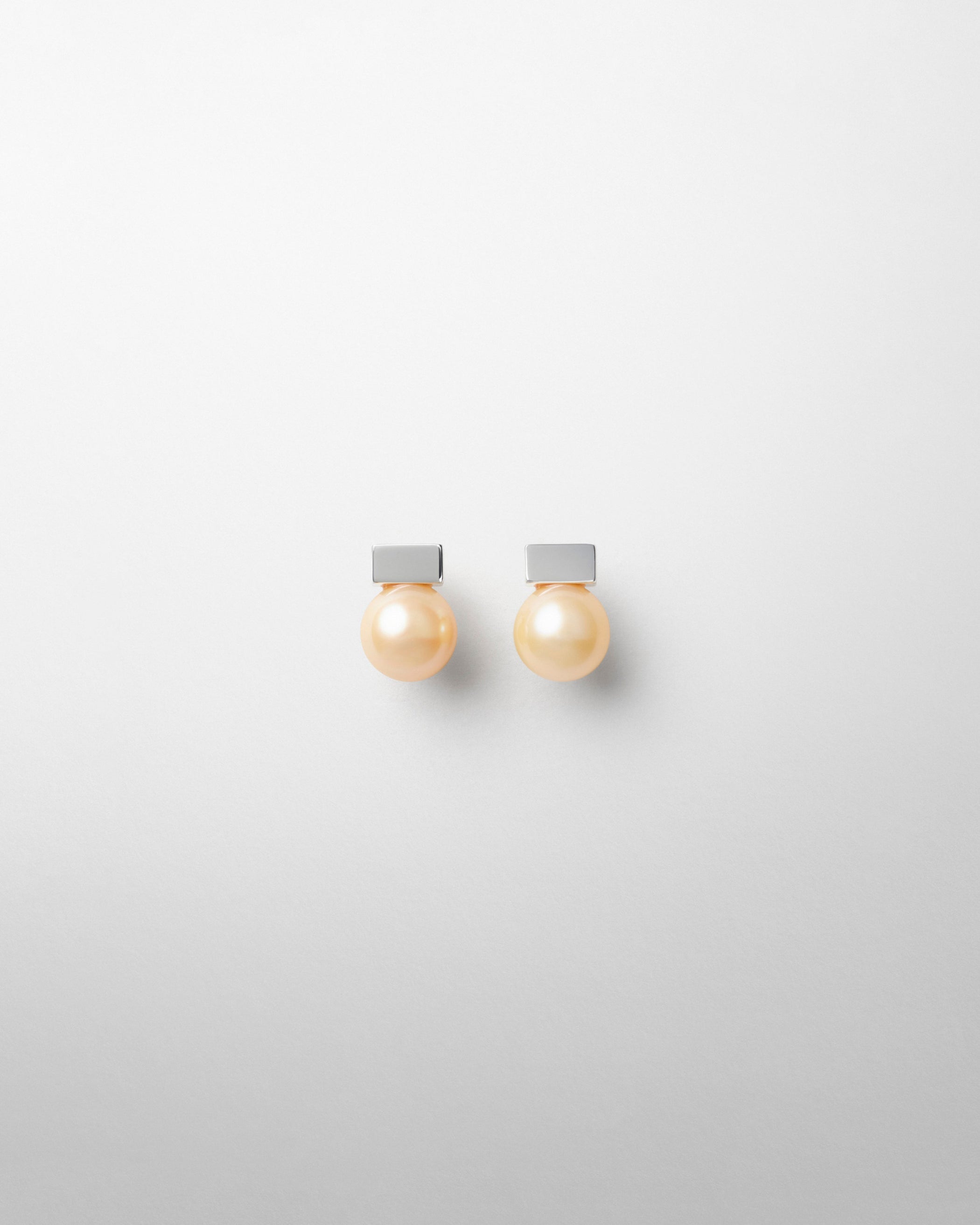 Front view of PEARL DROP STUDS in gold