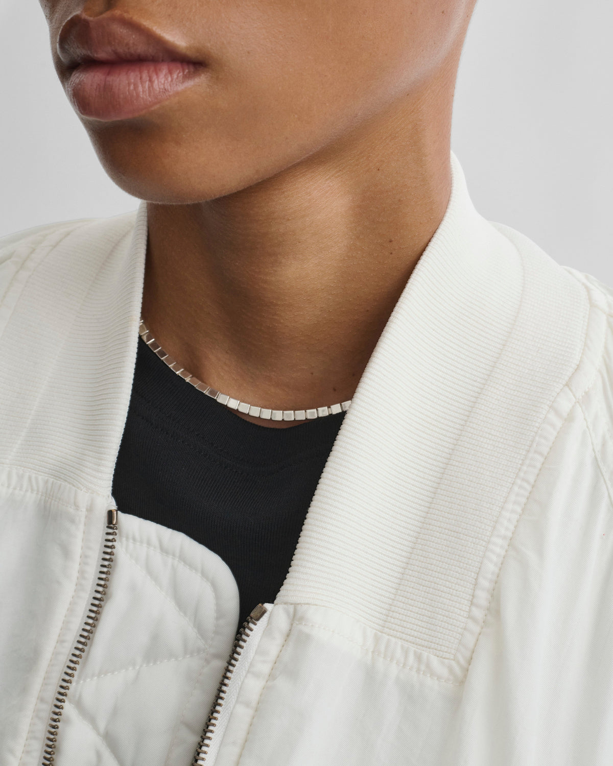 View of model wearing CUBIC NECKLACE in silver