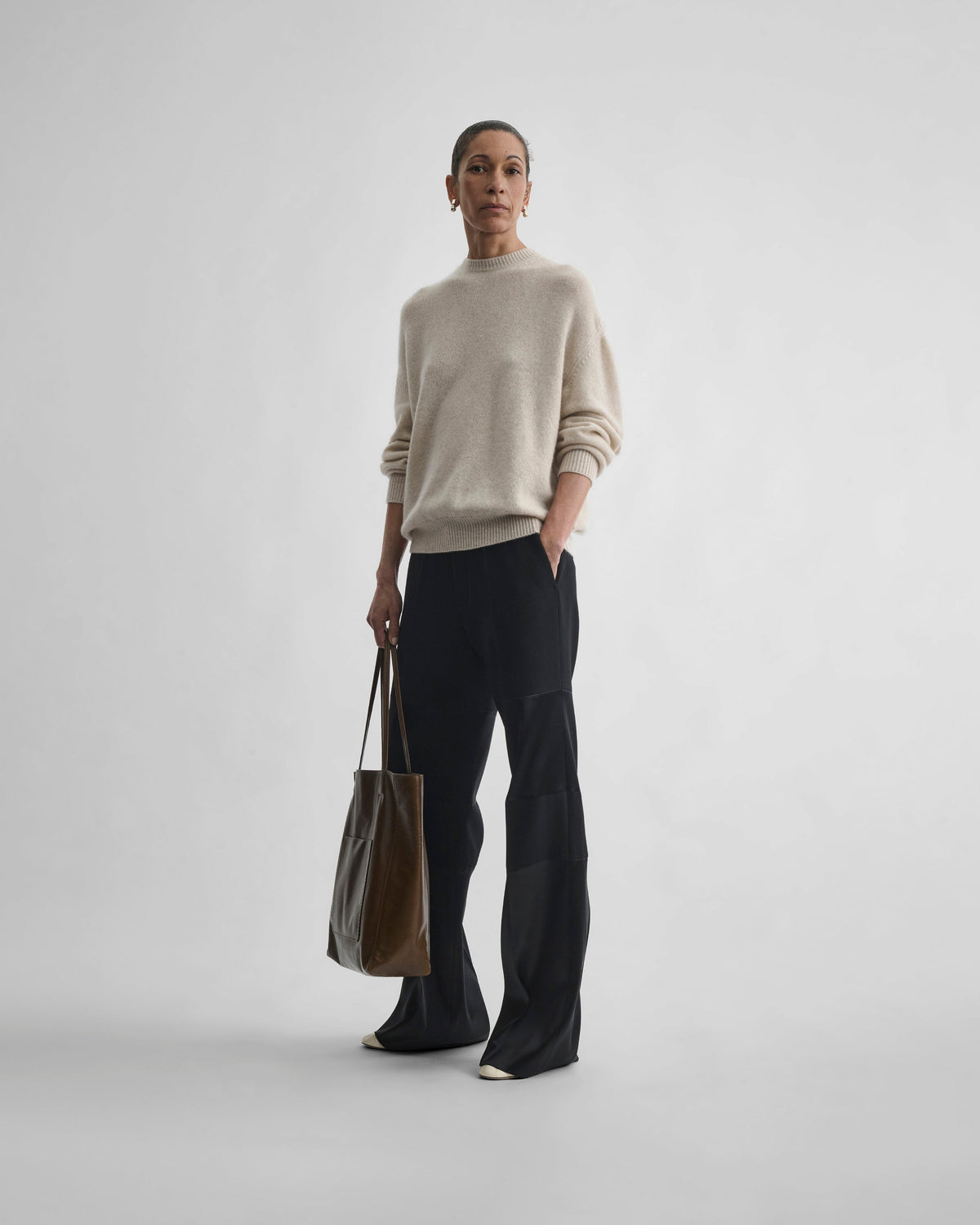 Front view of model wearing CREWNECK SWEATER in cream cashmere