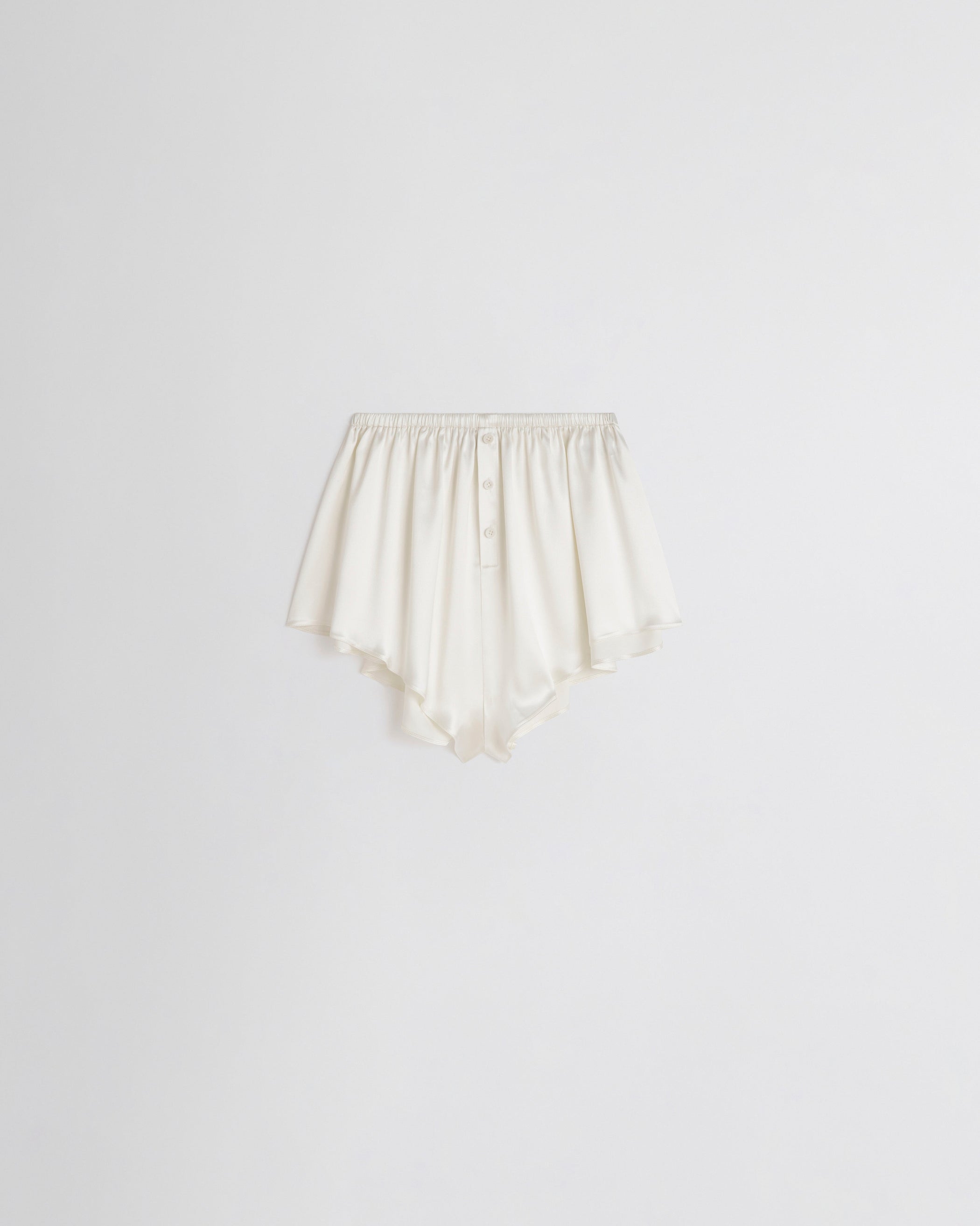 Flat front view of LIQUID SHORTS in cream silk