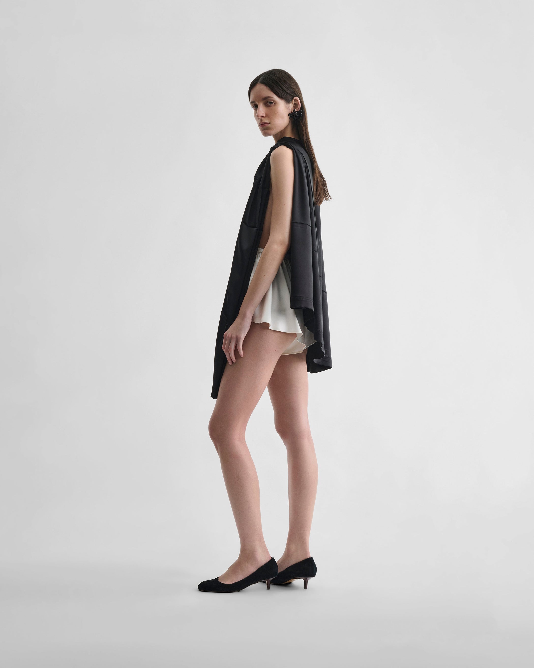 Front view of model wearing LIQUID SHORTS in cream silk