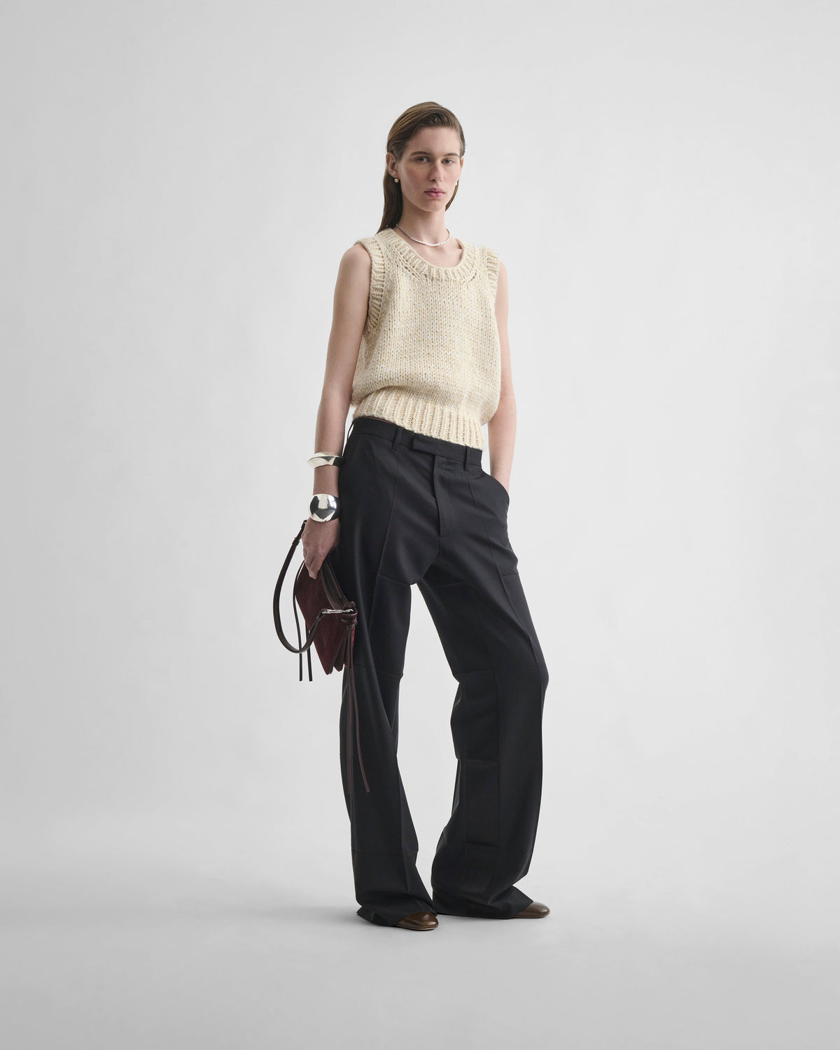 Front view of model wearing TUX BOYISH TROUSERS in black wool