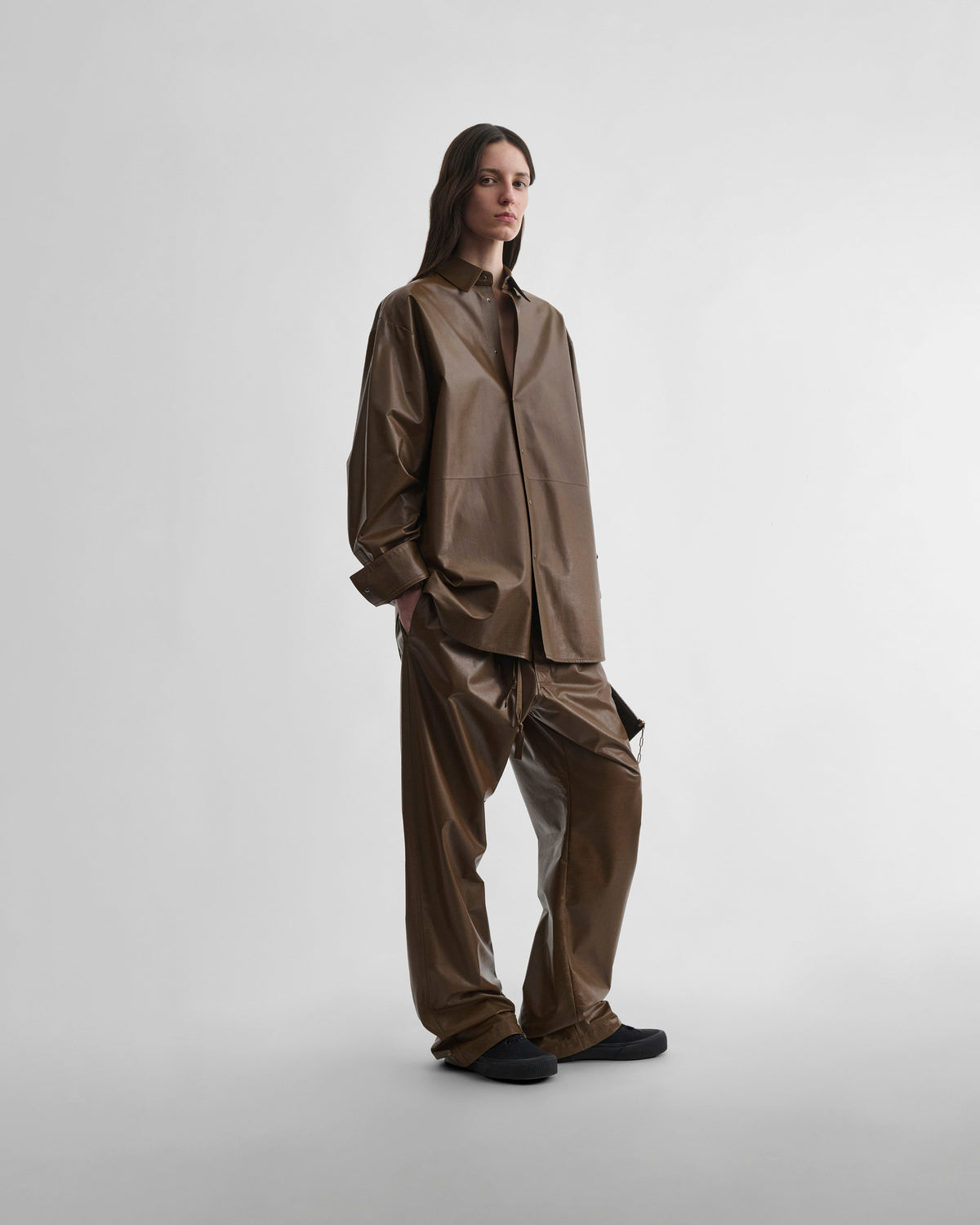 Front view of model wearing PYJAMA TROUSERS in tobacco leather