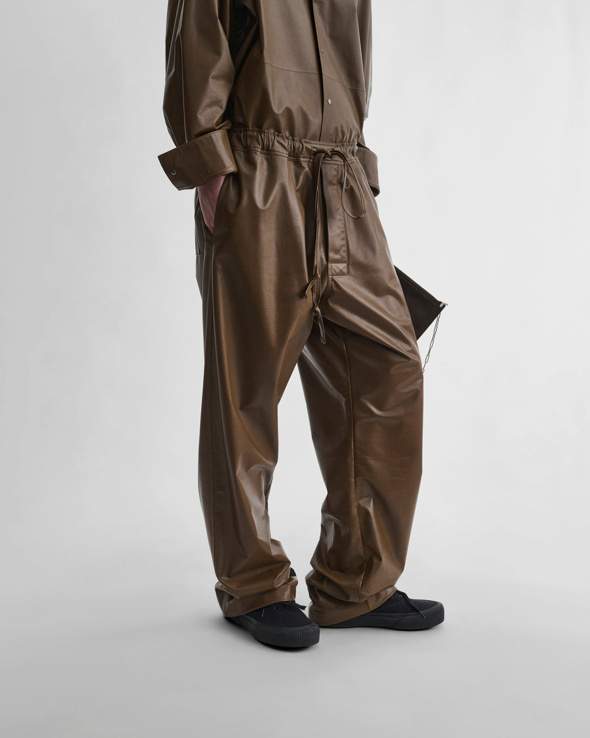 Front view of model wearing PYJAMA TROUSERS in tobacco leather