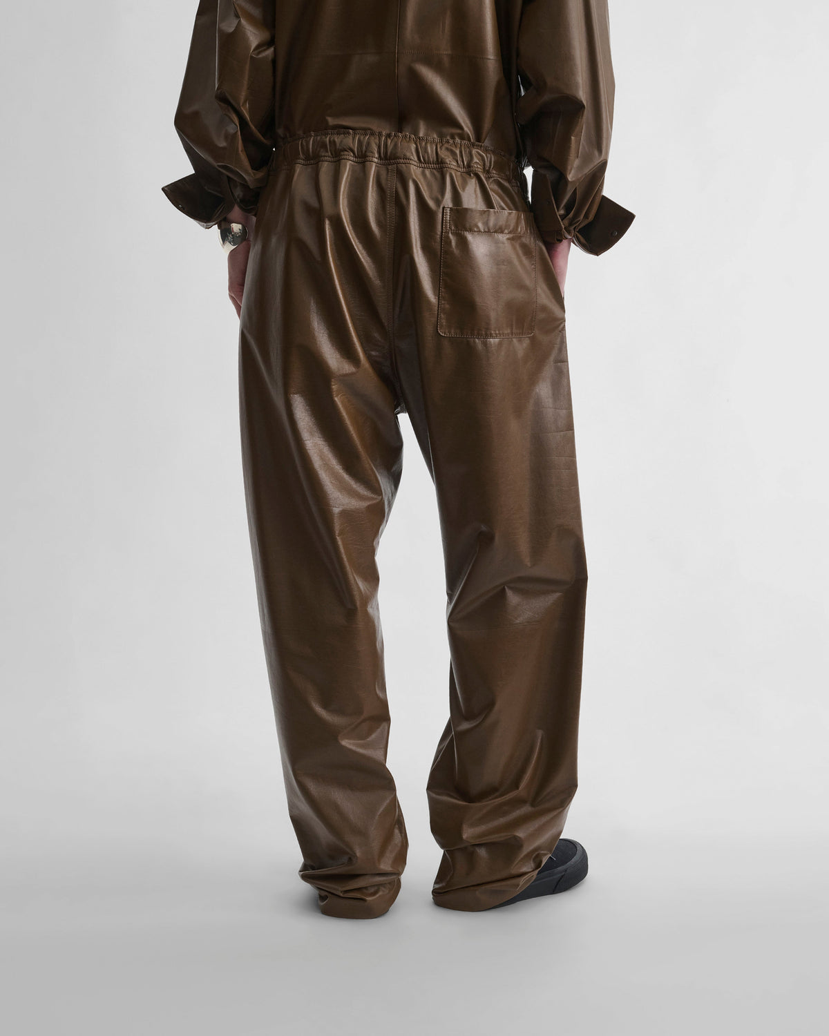Back view of model wearing PYJAMA TROUSERS in tobacco leather