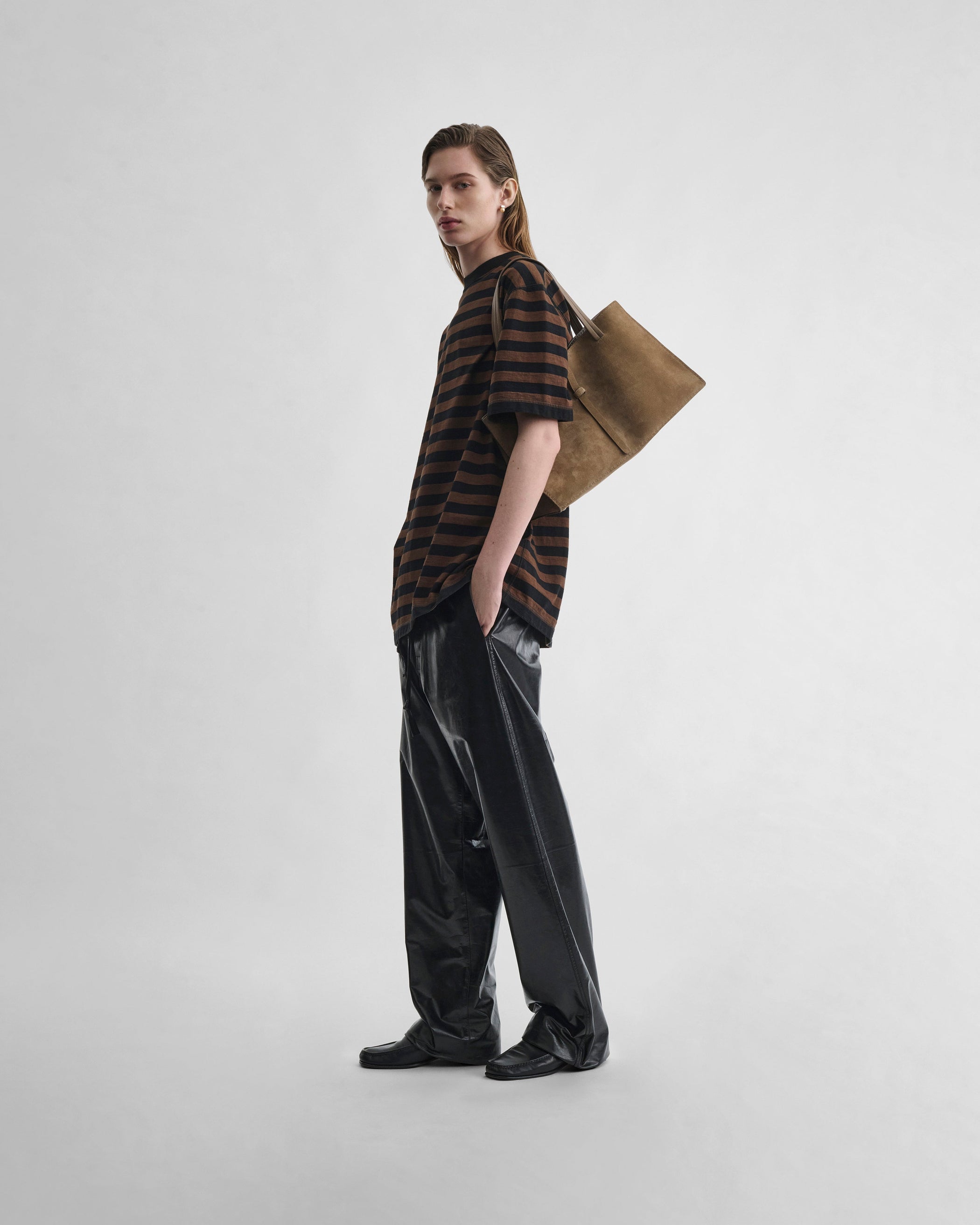 Front view of model wearing PYJAMA TROUSERS in black leather