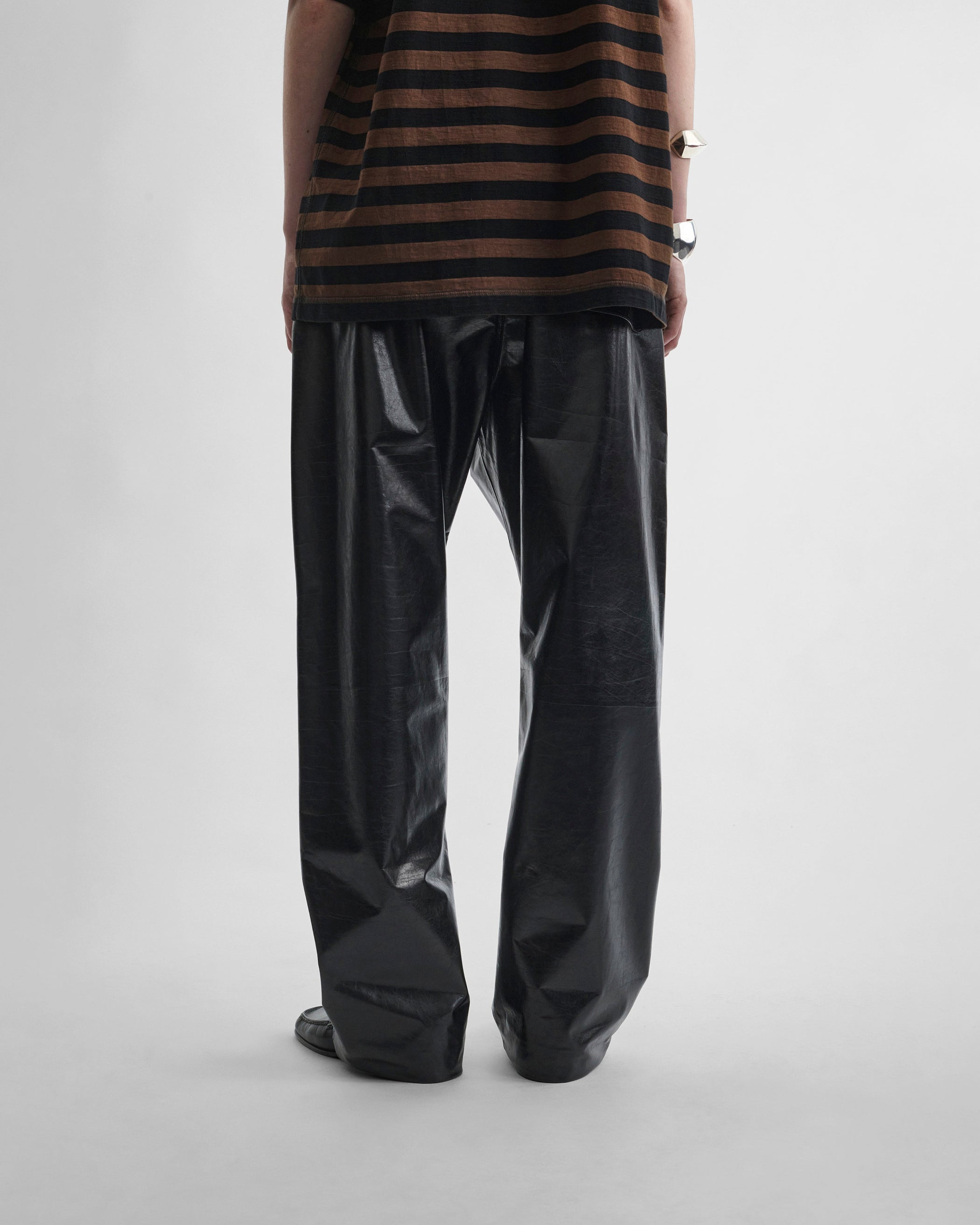 Back view of model wearing PYJAMA TROUSERS in black leather