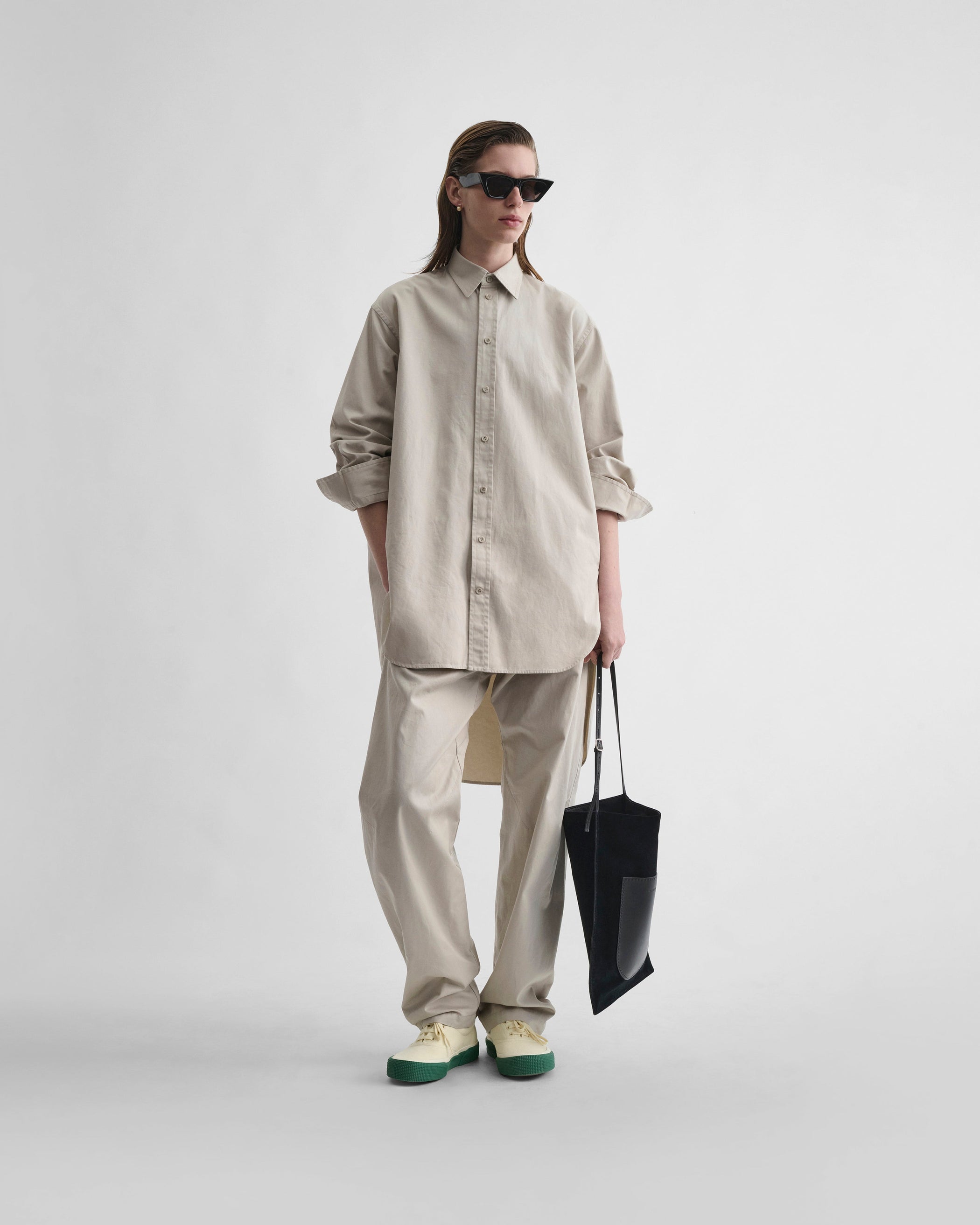 Front view model wearing ARCH TROUSERS in gum cotton