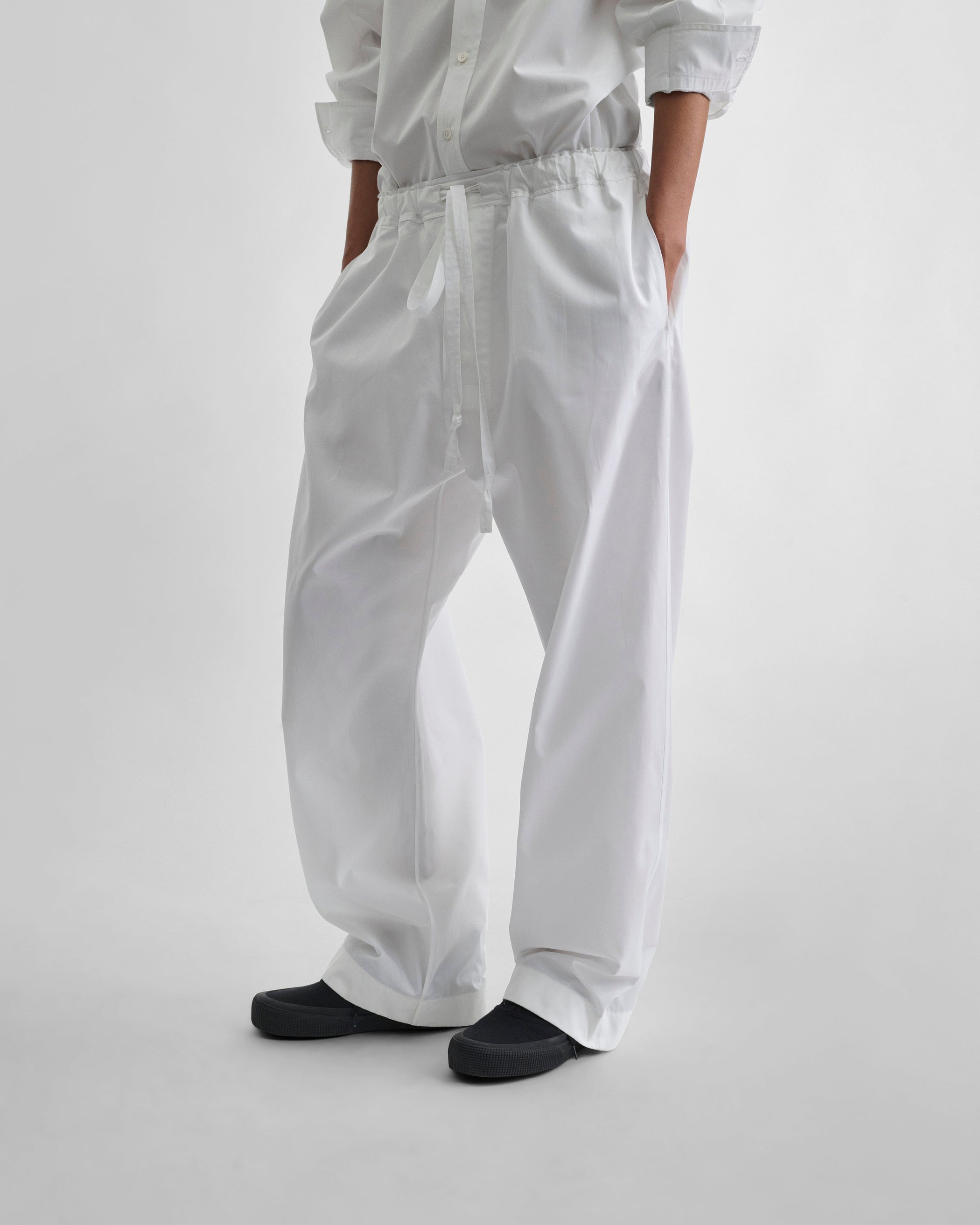 Front view of model wearing PYJAMA TROUSERS in white cotton