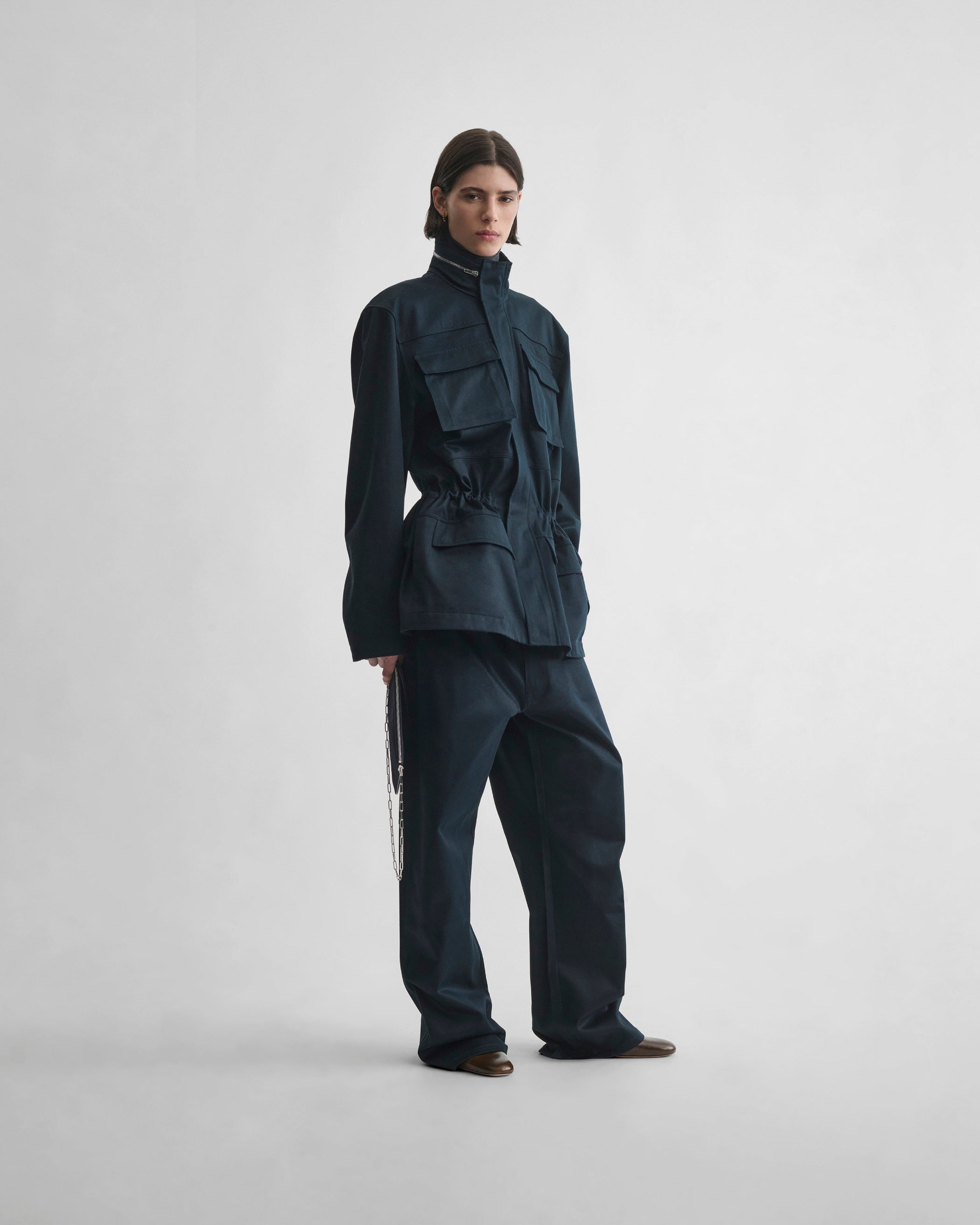 Front view of model wearing CARPENTER JEANS in black ink cotton