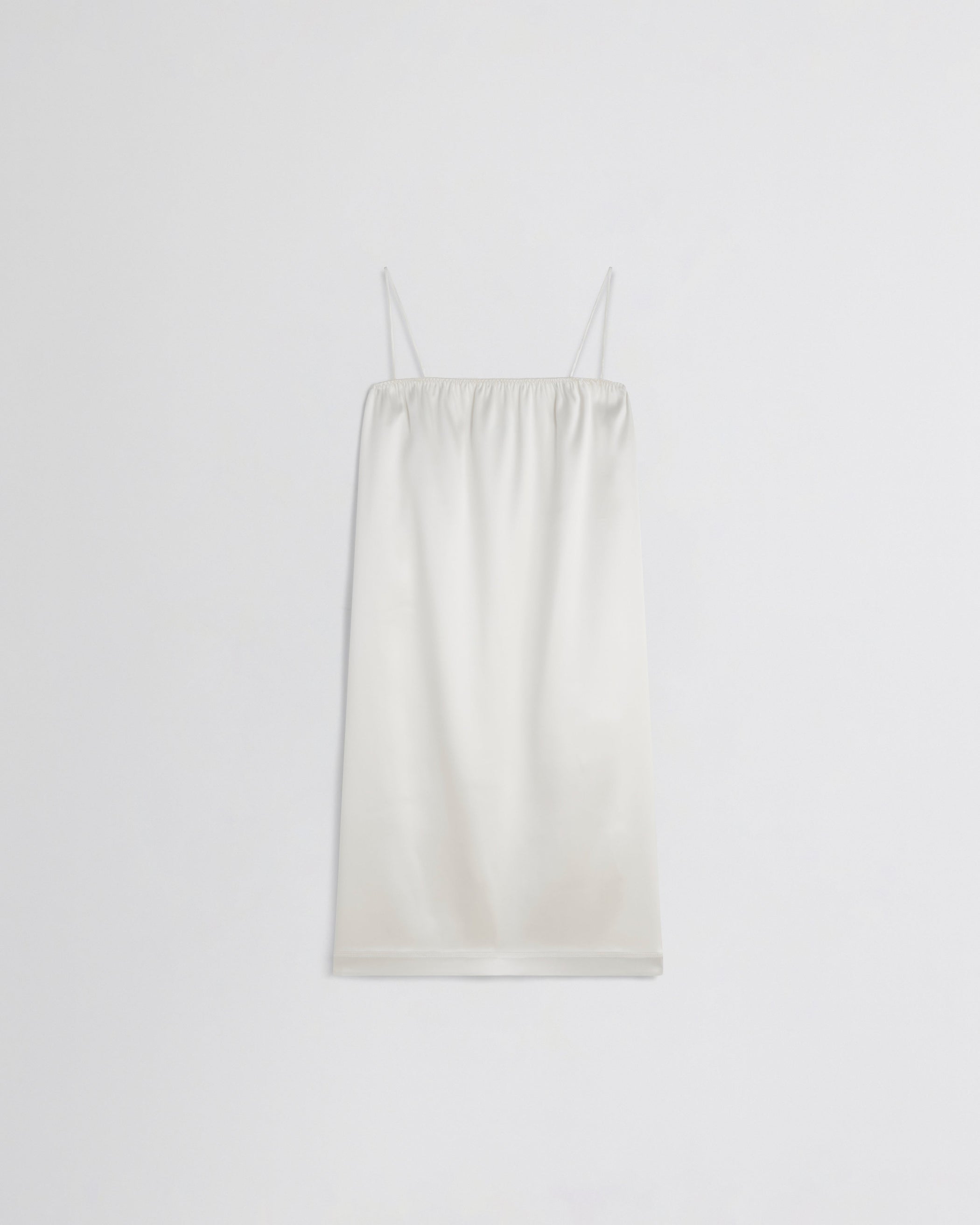 Flat front view of LIQUID SLIP DRESS in acid ivory silk