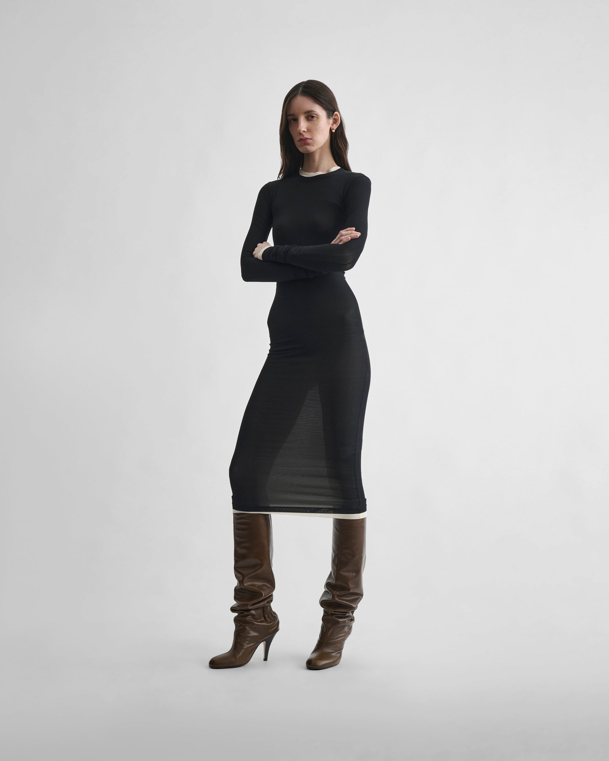 Front view of model wearing HUG DRESS in black viscose