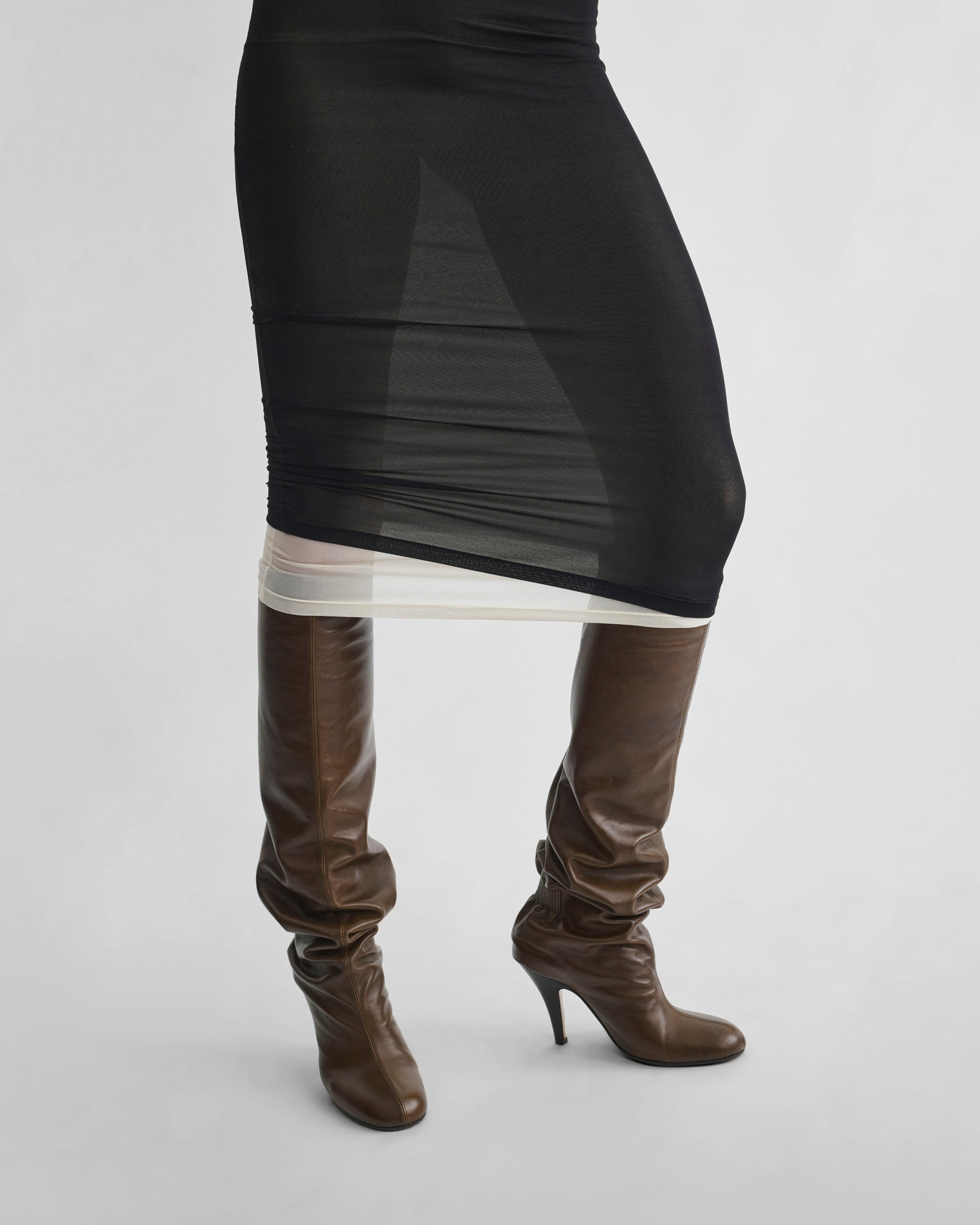 Detail view of model wearing HUG DRESS in black viscose
